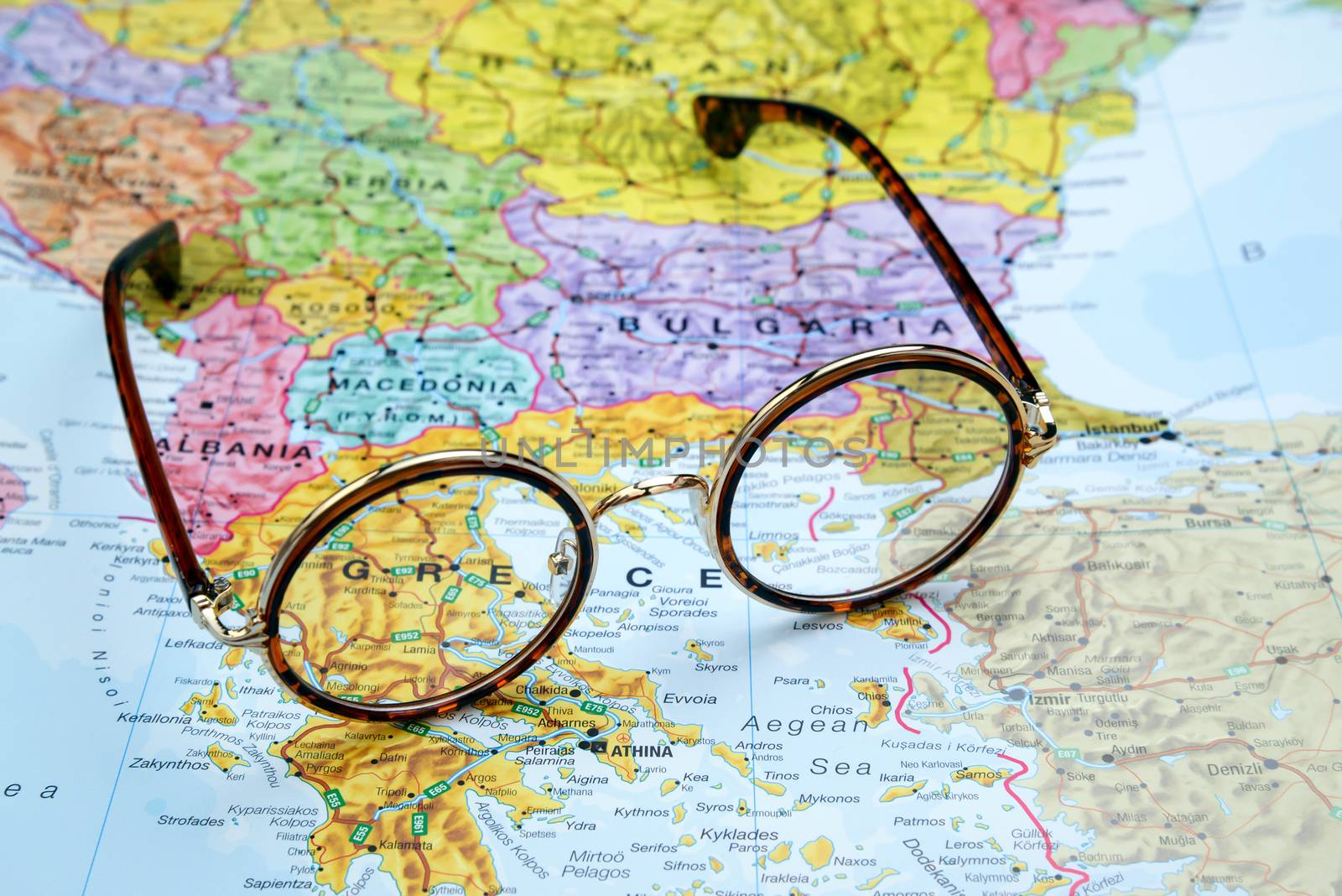 Glasses on a map of europe - Greece by dk_photos