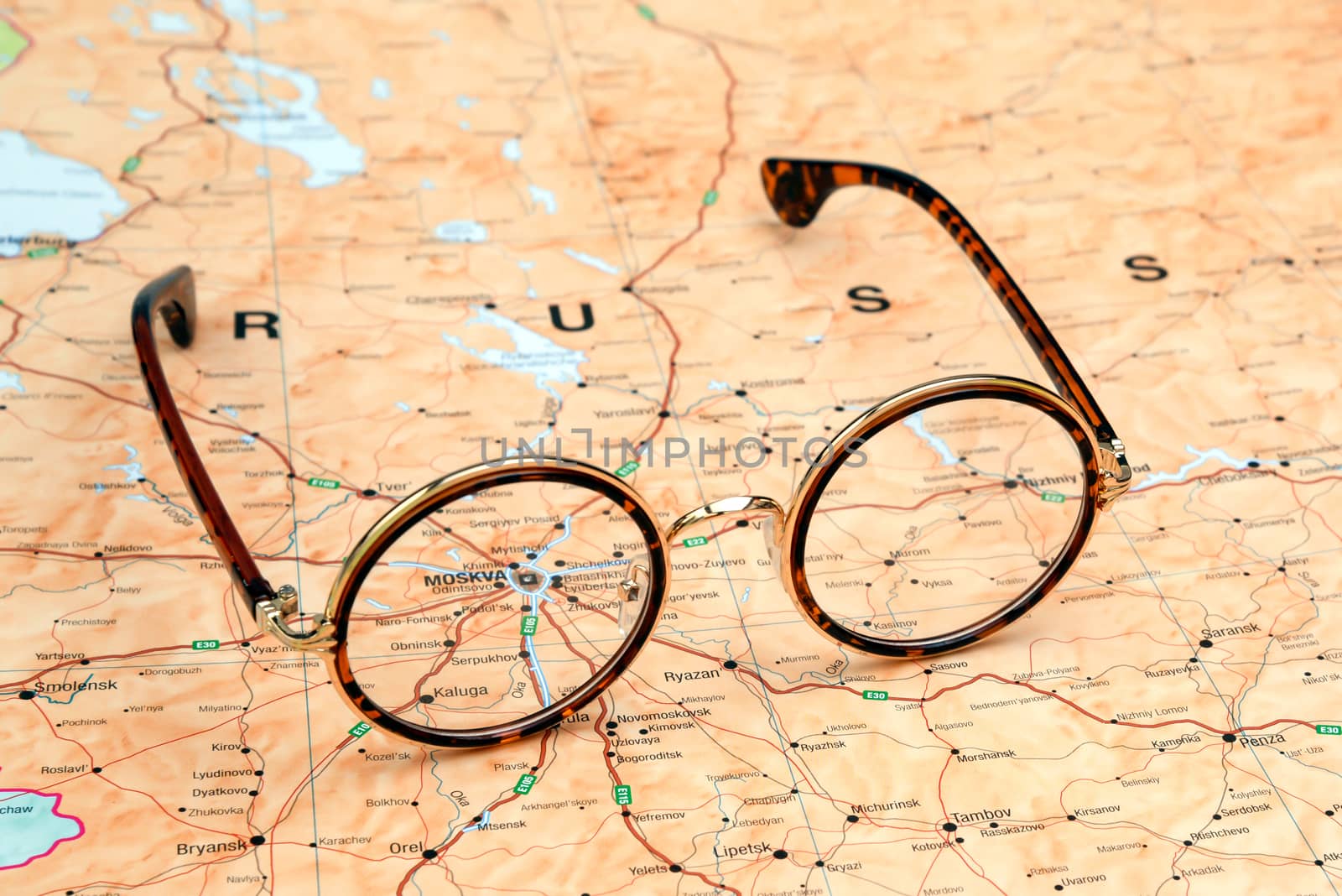 Photo of glasses on a map of europe. Focus on Moscow. May be used as illustration for traveling theme.