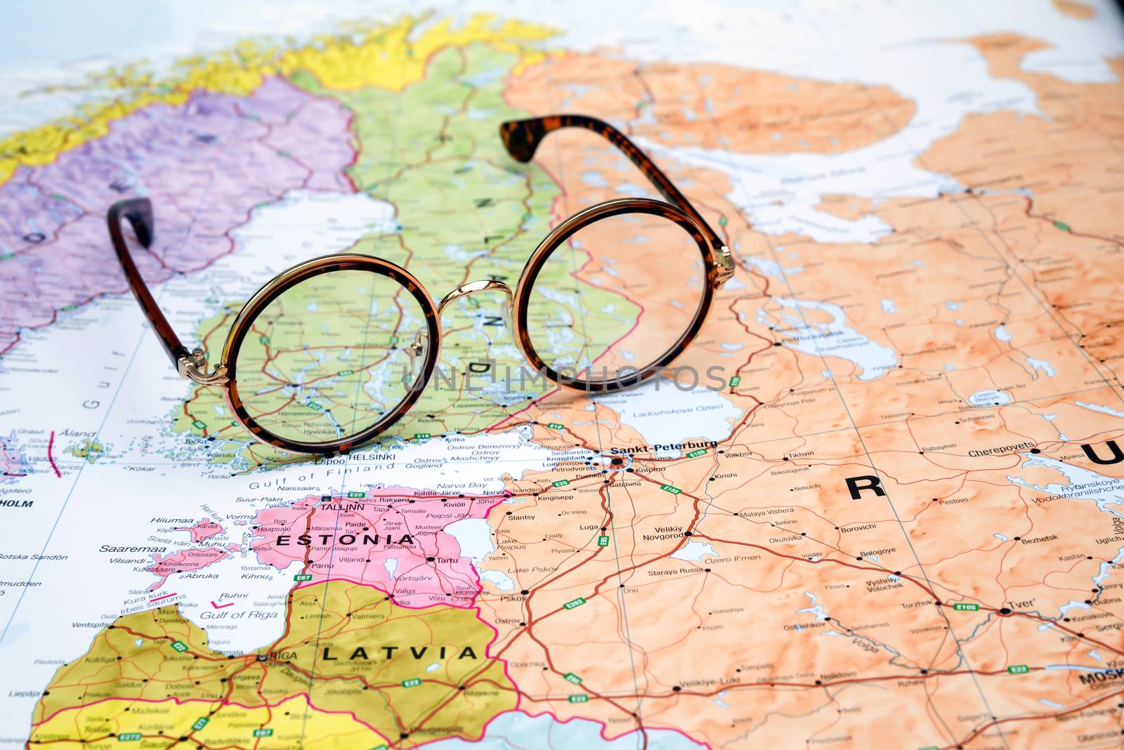 Photo of glasses on a map of europe. Focus on Finland. May be used as illustration for traveling theme.