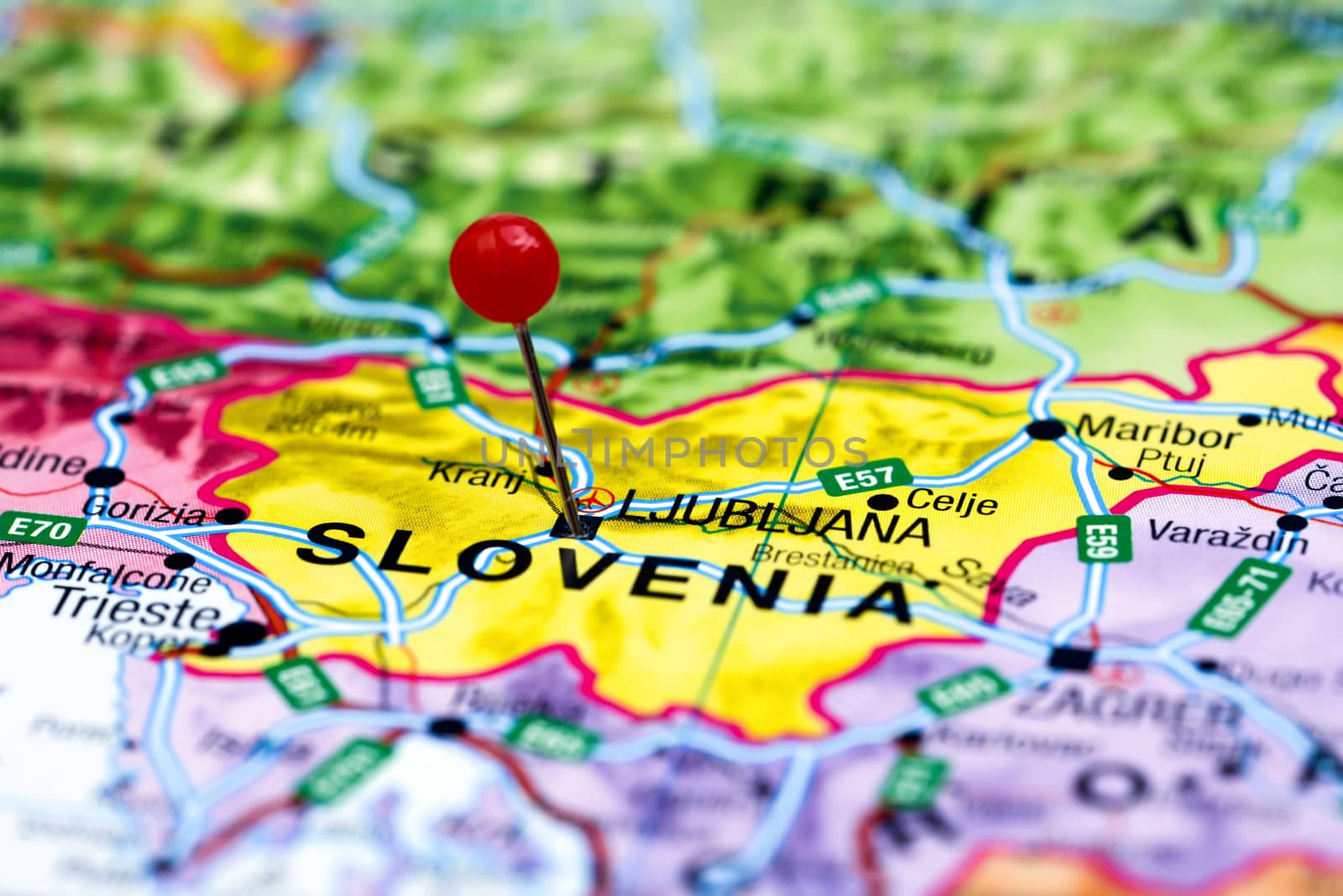 Photo of pinned Ljubljana on a map of europe. May be used as illustration for traveling theme.