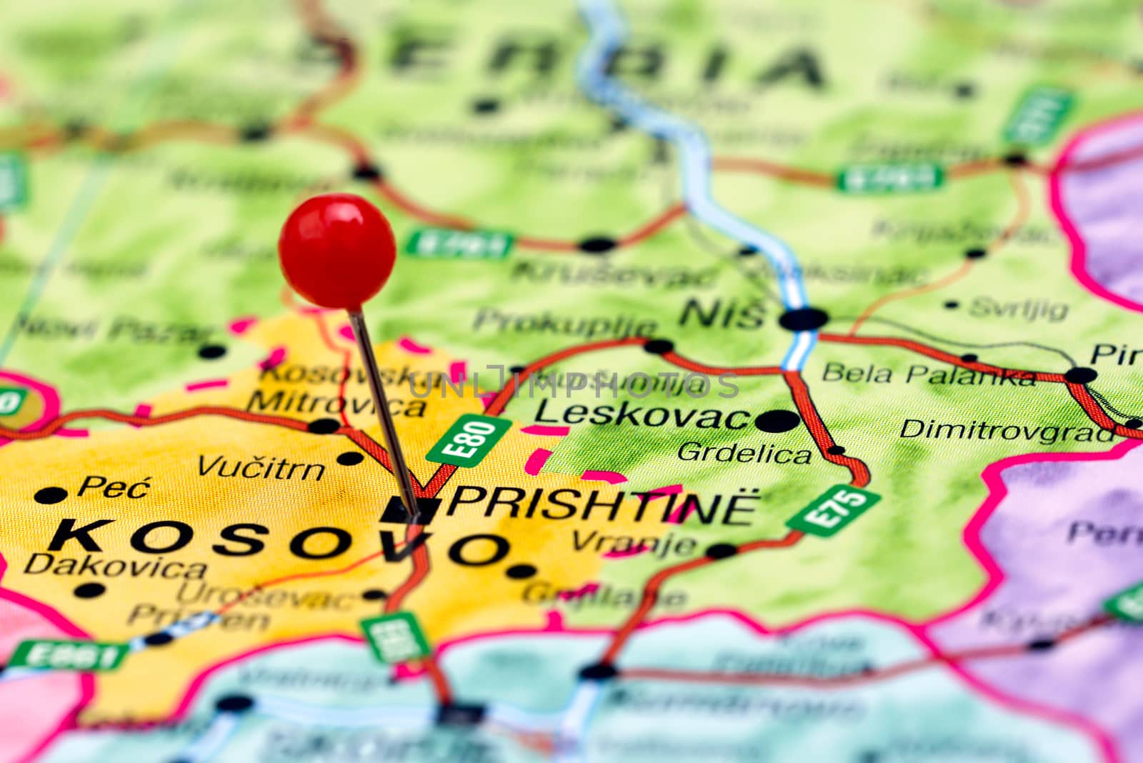 Photo of pinned Prishtine on a map of europe. May be used as illustration for traveling theme.