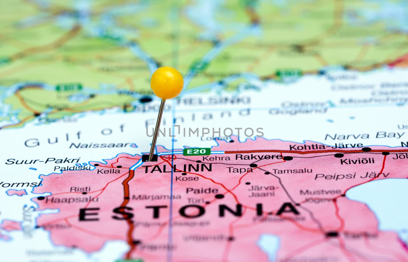 Photo of pinned Tallinn on a map of europe. May be used as illustration for traveling theme.