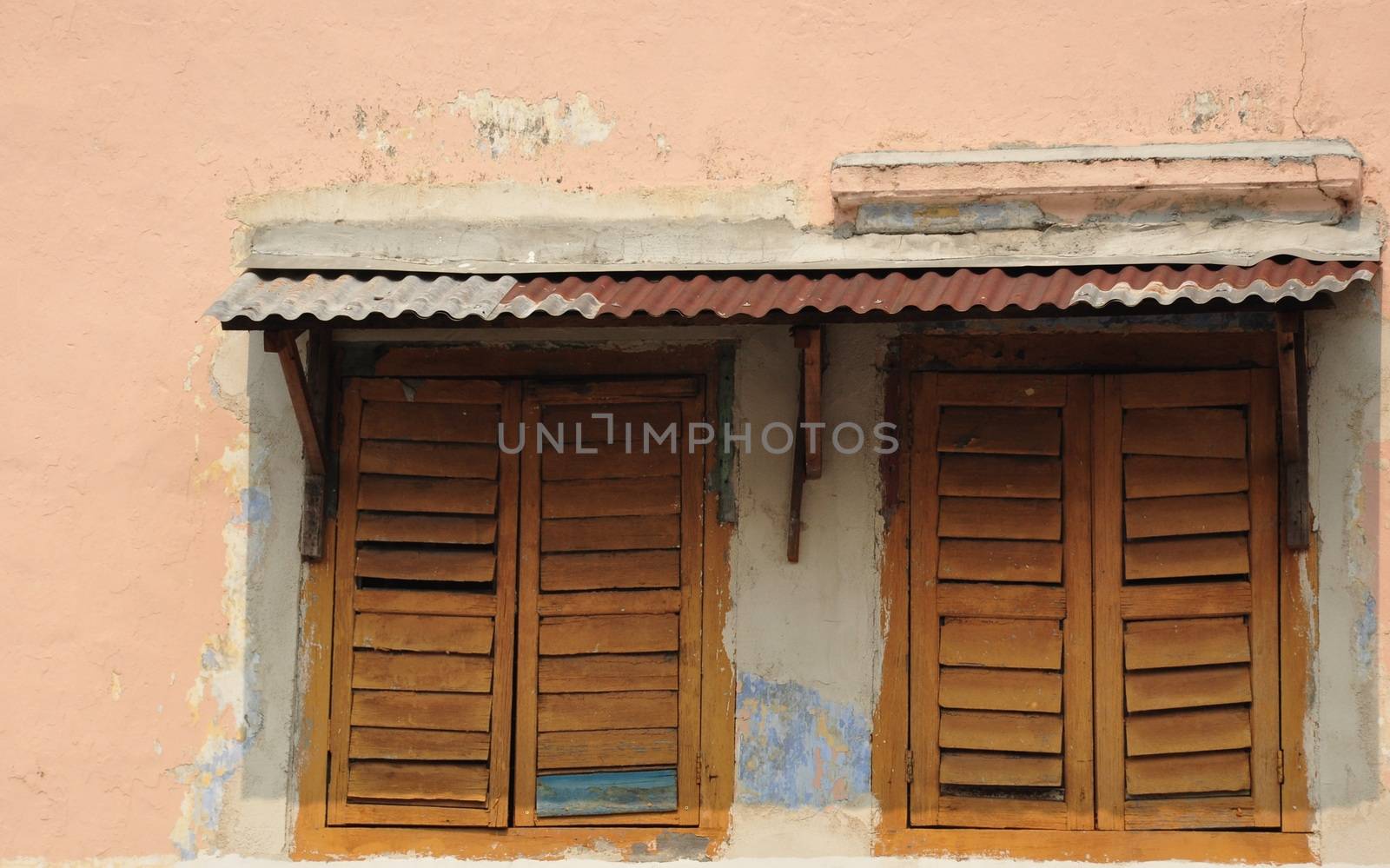 A pair of wooden windows in an ancient building in Ipoh Malaysia