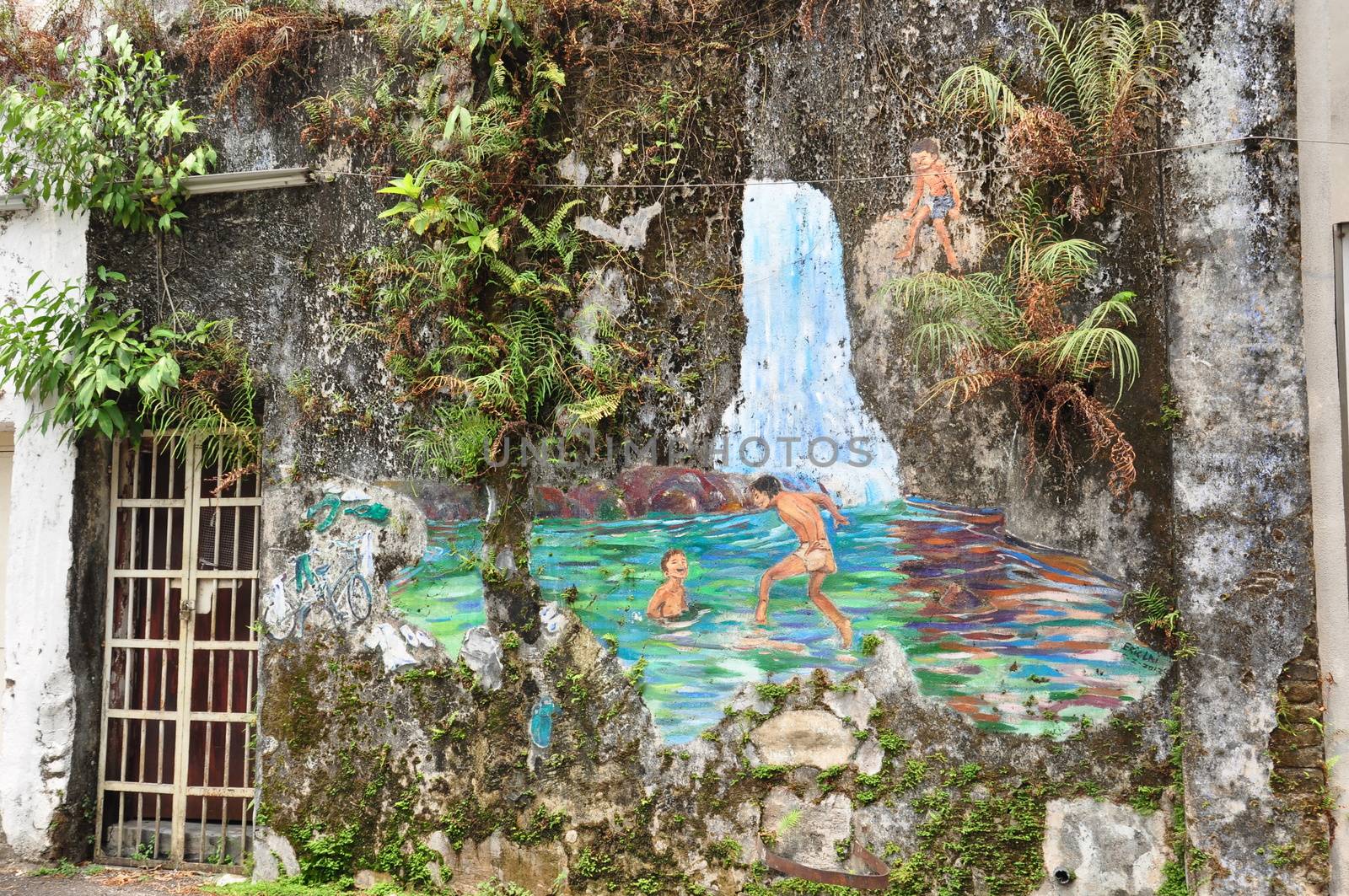 graffiti of waterfall and ponds on the ward at the back street in Ipoh Malaysia