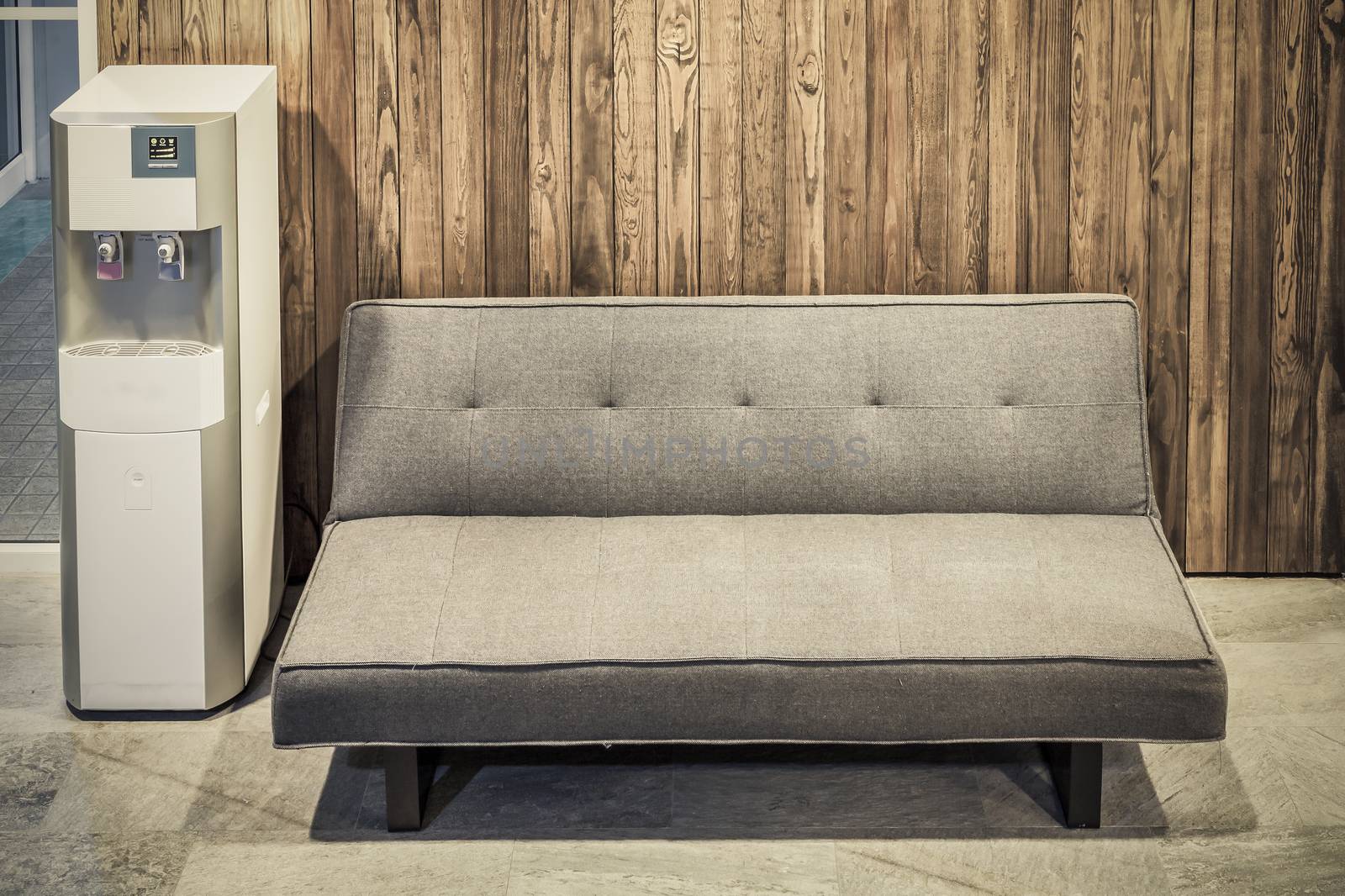 sofa furniture and water cooler on wood texture background by FrameAngel