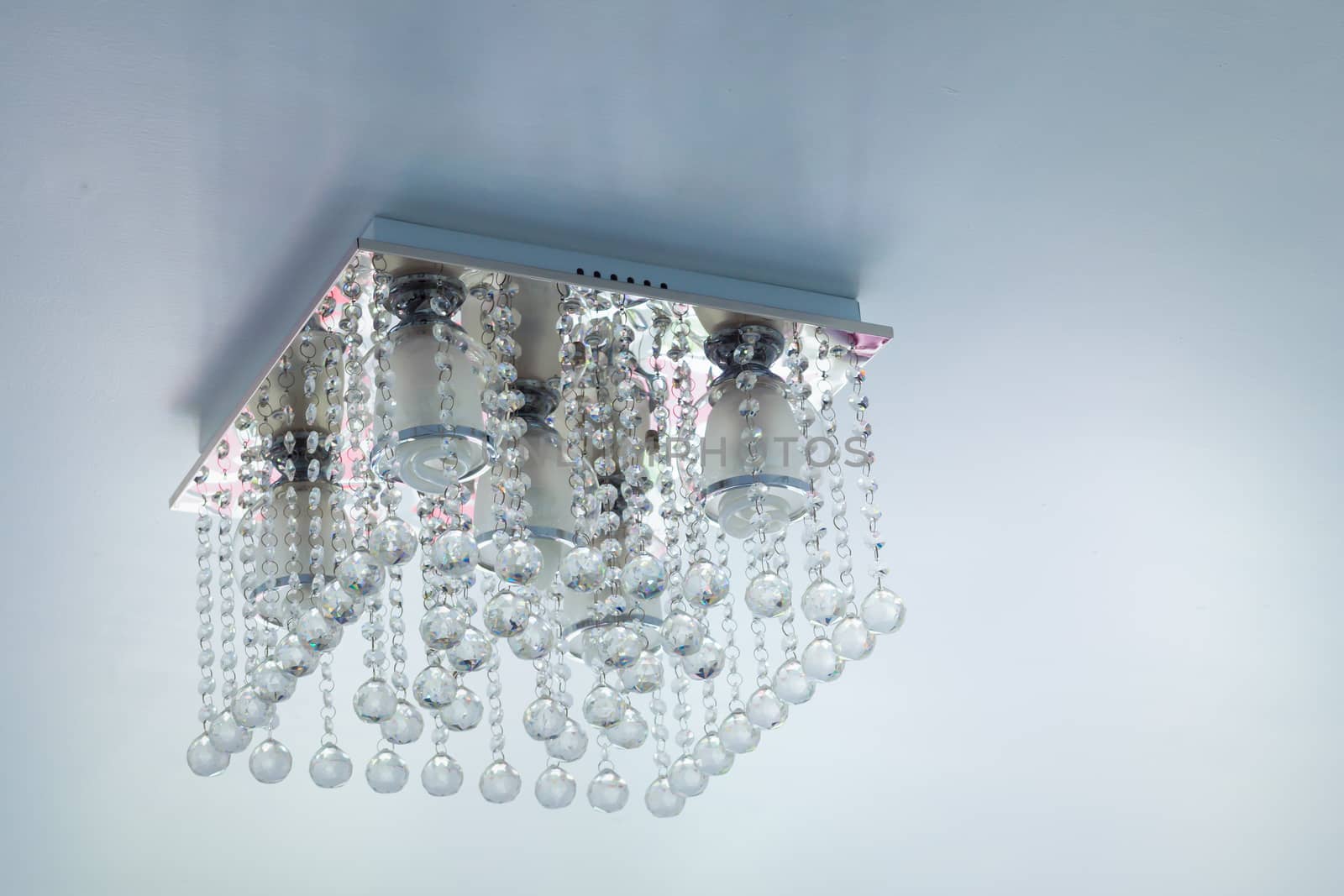 Crystal chandelier on ceiling by FrameAngel