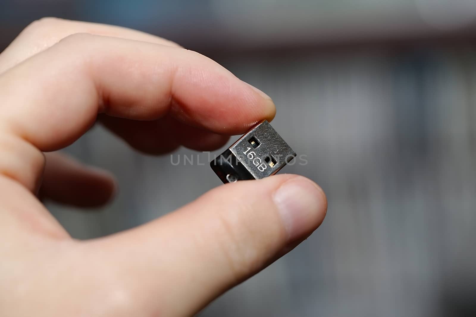 Tiny USB drive being held