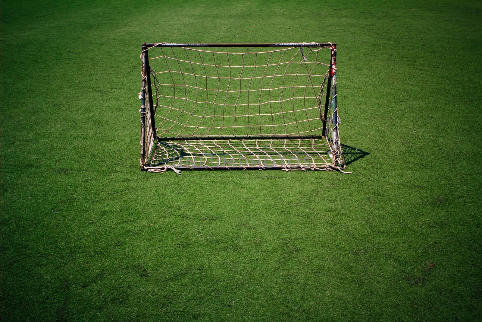 Soccer goal net in the the plastic sports field