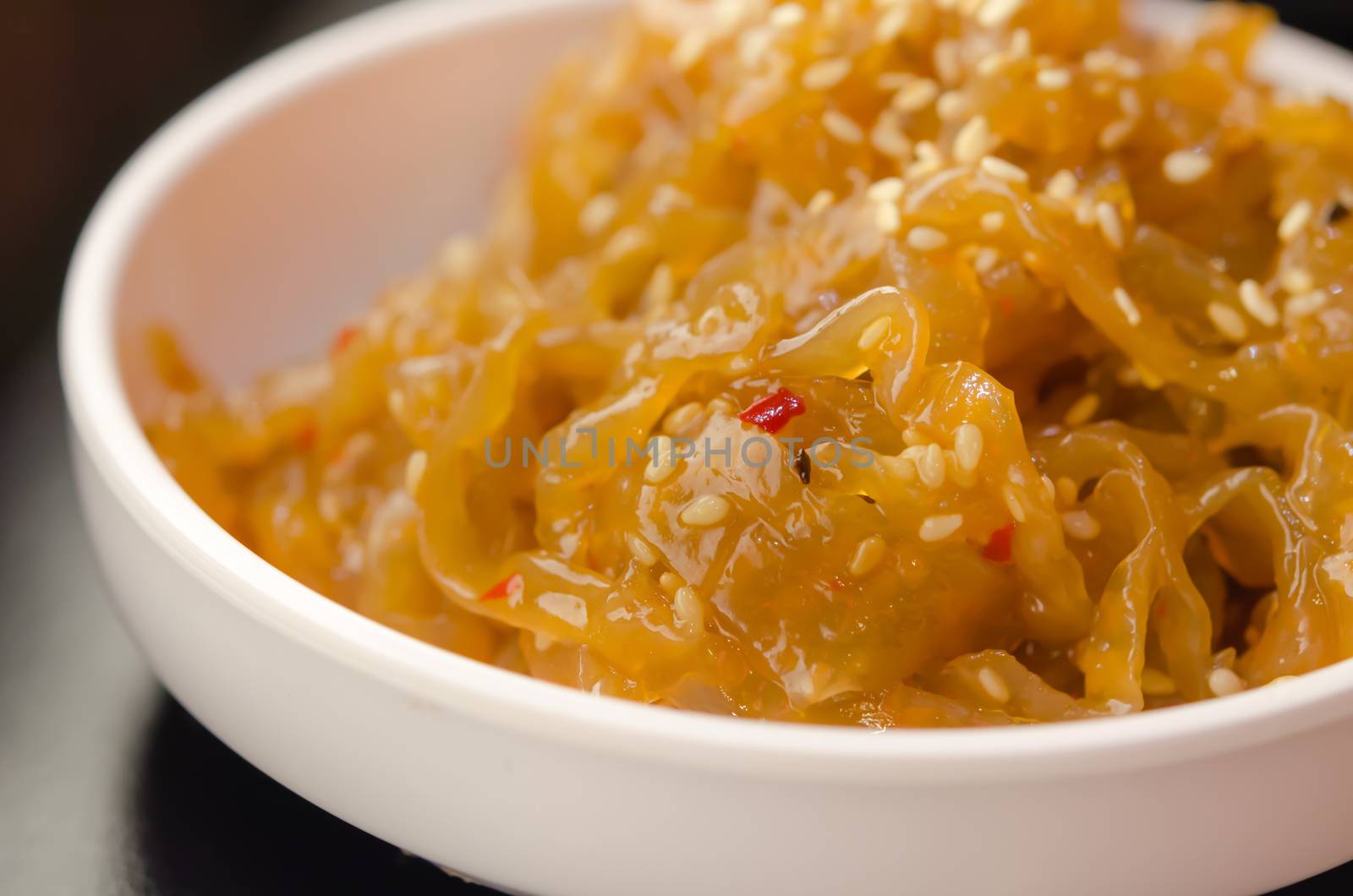 gourmet tossed jellyfish salad in white bowl , Chinese cuisine