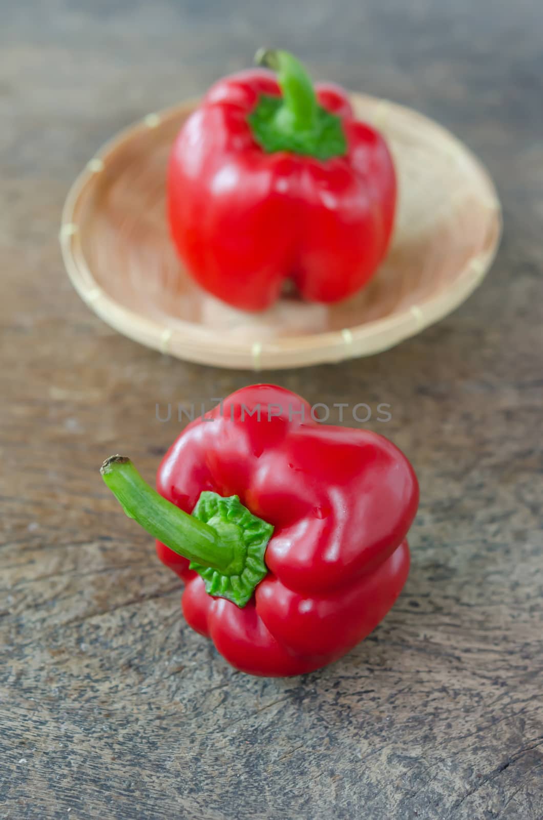 red bell peppers on wooden table