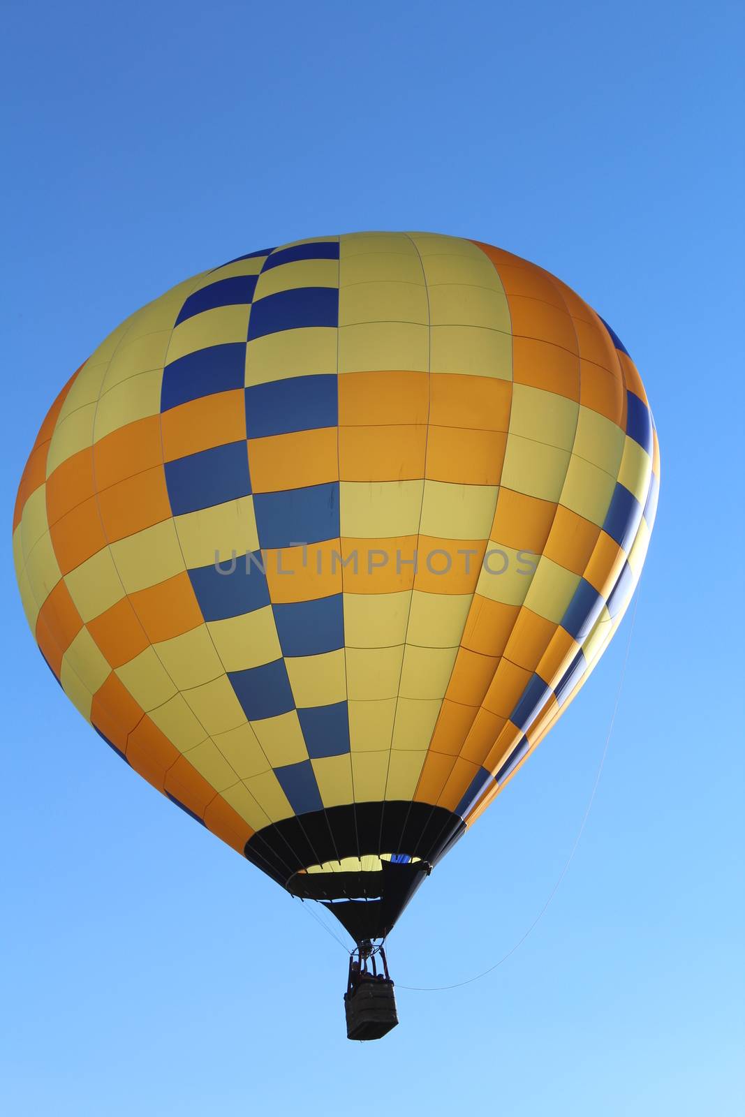 Ferrara, Italia - September 14, 2014: The photo was made at the Ballons Festival at Ferrara on september 14, 2014.A hot air balloon gets up in the sky