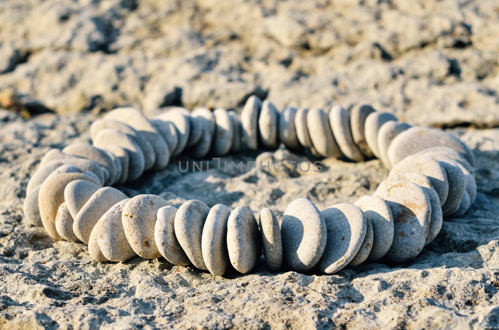 Sequence of small stones laid out in the form of a ellipse