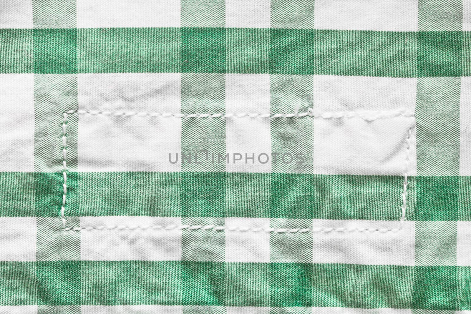 Green and white checked cotton pattern with a thread rectangle