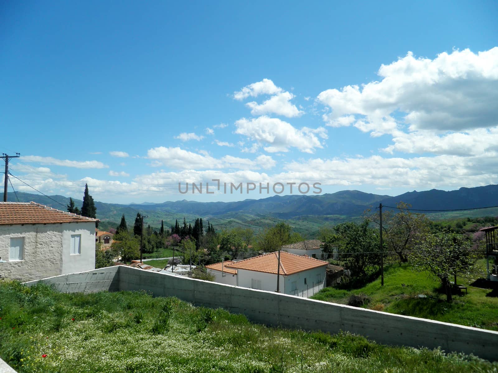 Panoramic view of a green meadow and the blue sky in central Greece,

Picture taken on April 21, 2012