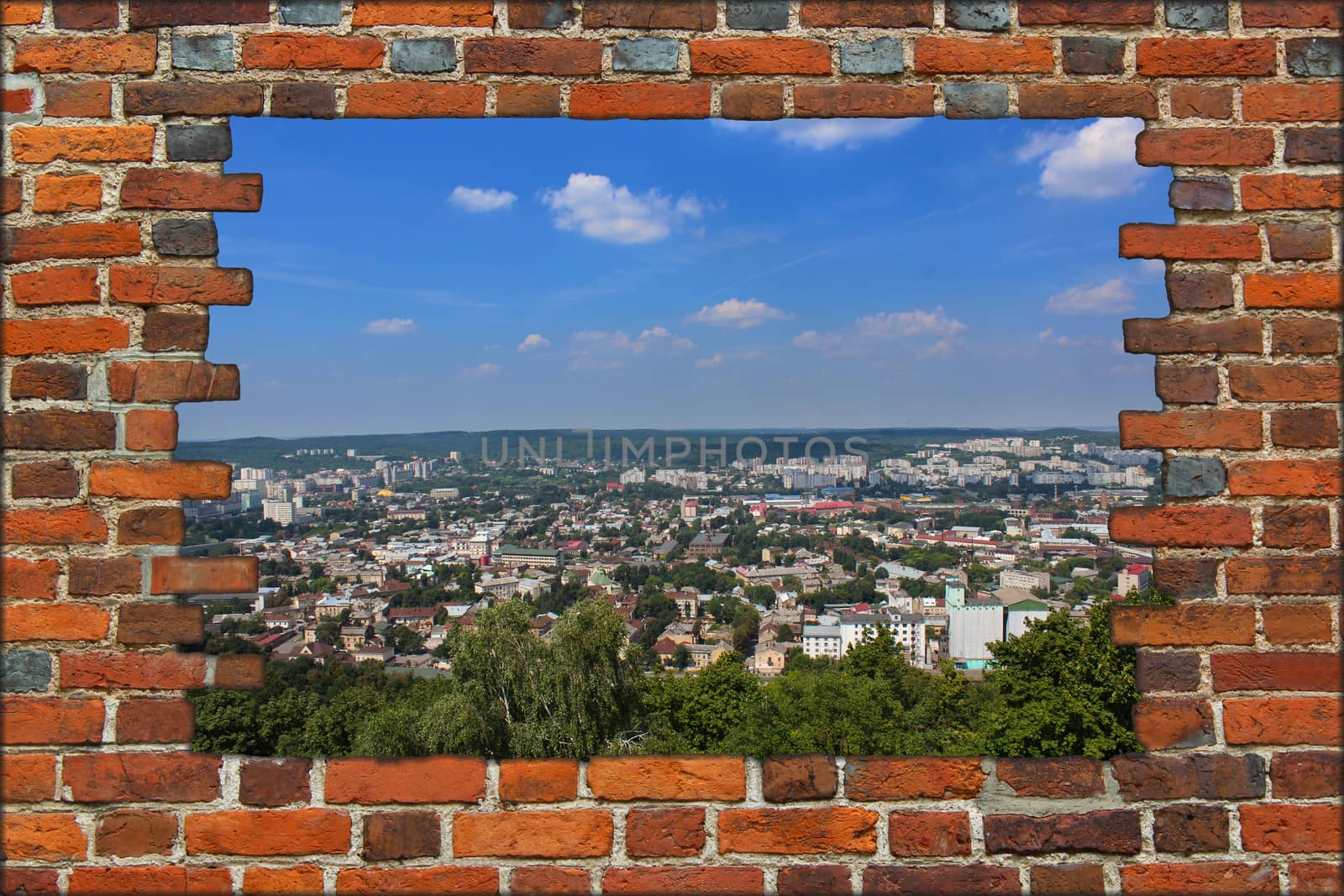 broken wall from the red brick and view to the big city