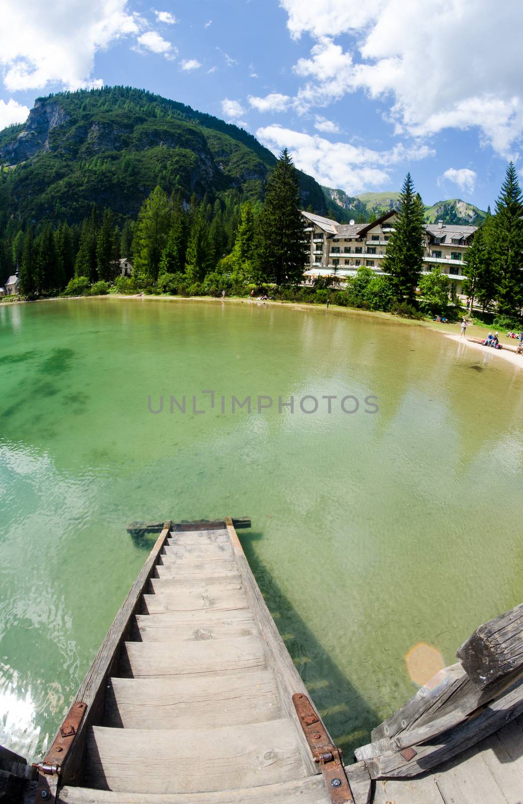 Wonderful waters of Braies lake on a summer day - Italian Alps.