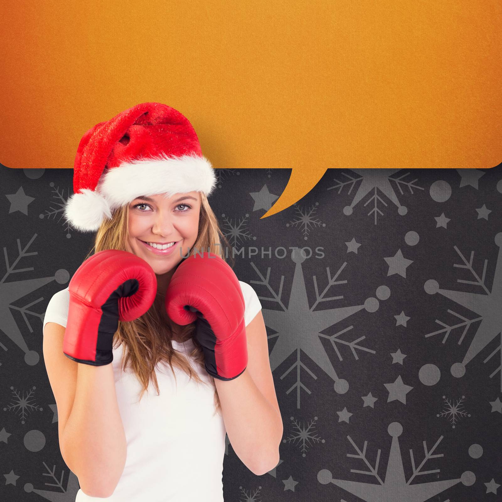 Composite image of festive blonde with boxing gloves by Wavebreakmedia