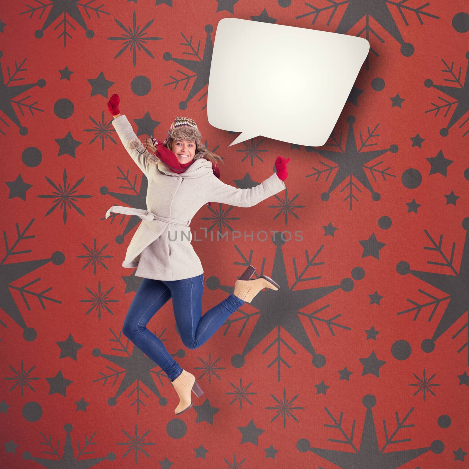 Composite image of happy blonde in winter clothes posing by Wavebreakmedia