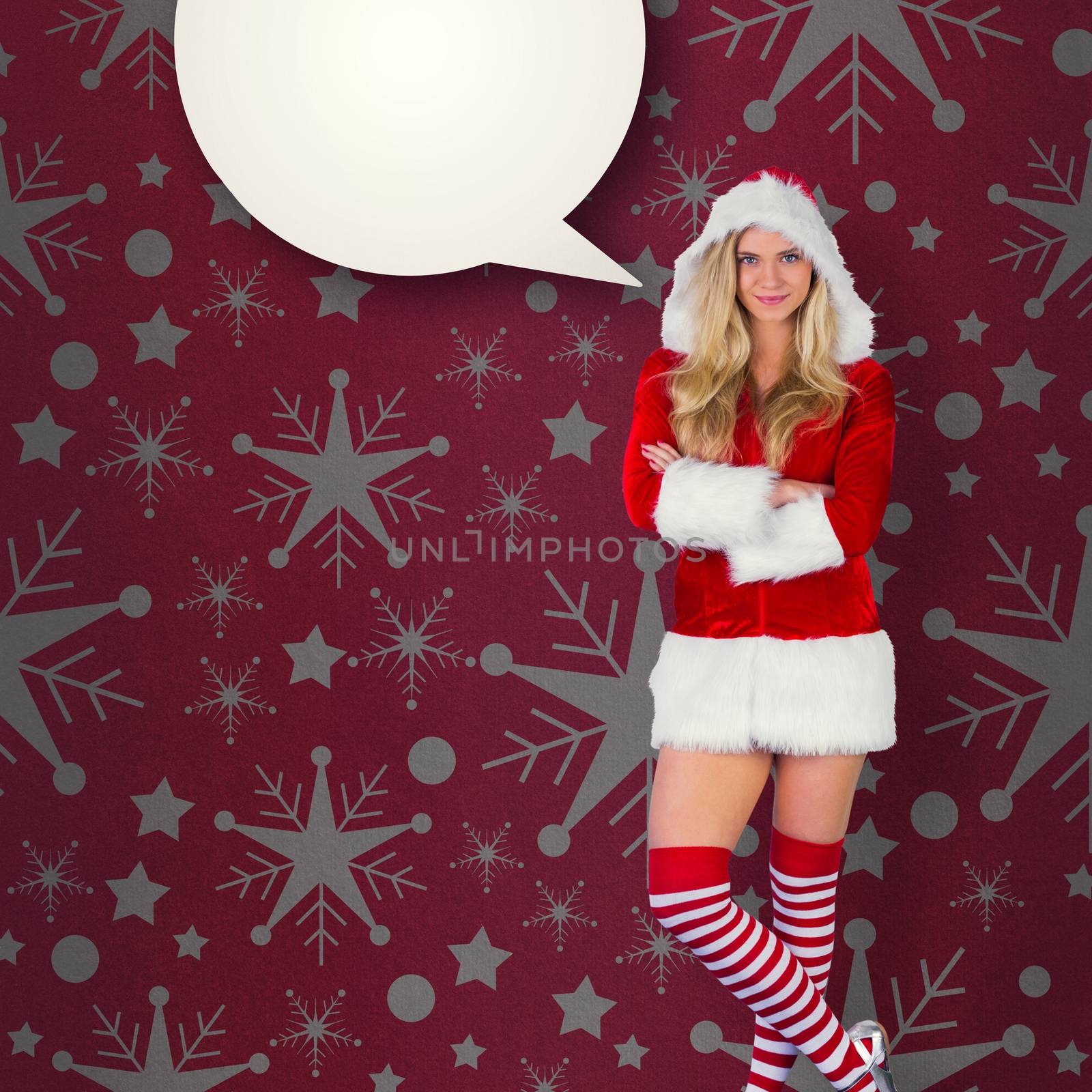 Pretty girl in santa outfit with arms crossed against red vignette