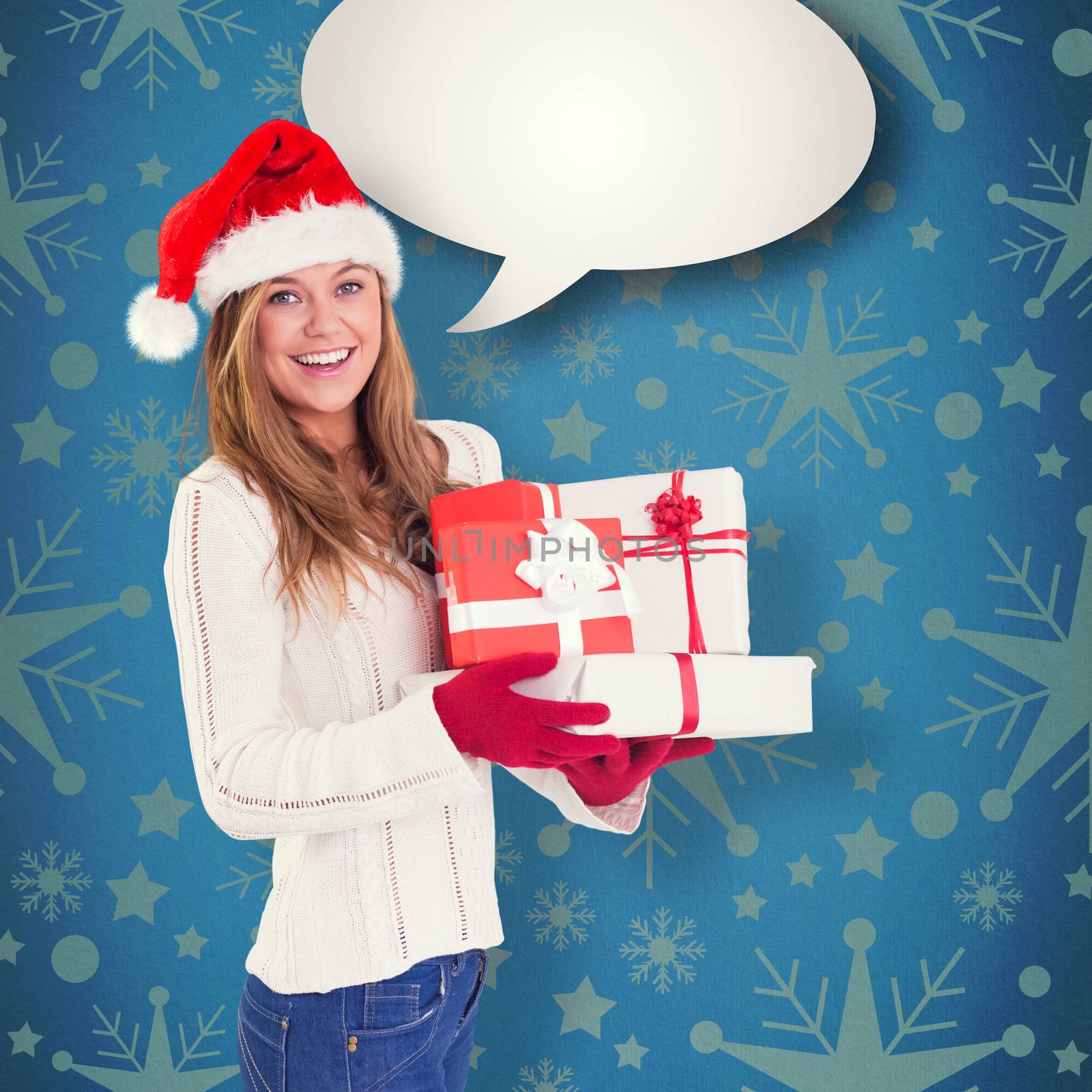 Festive blonde holding pile of gifts against blue vignette