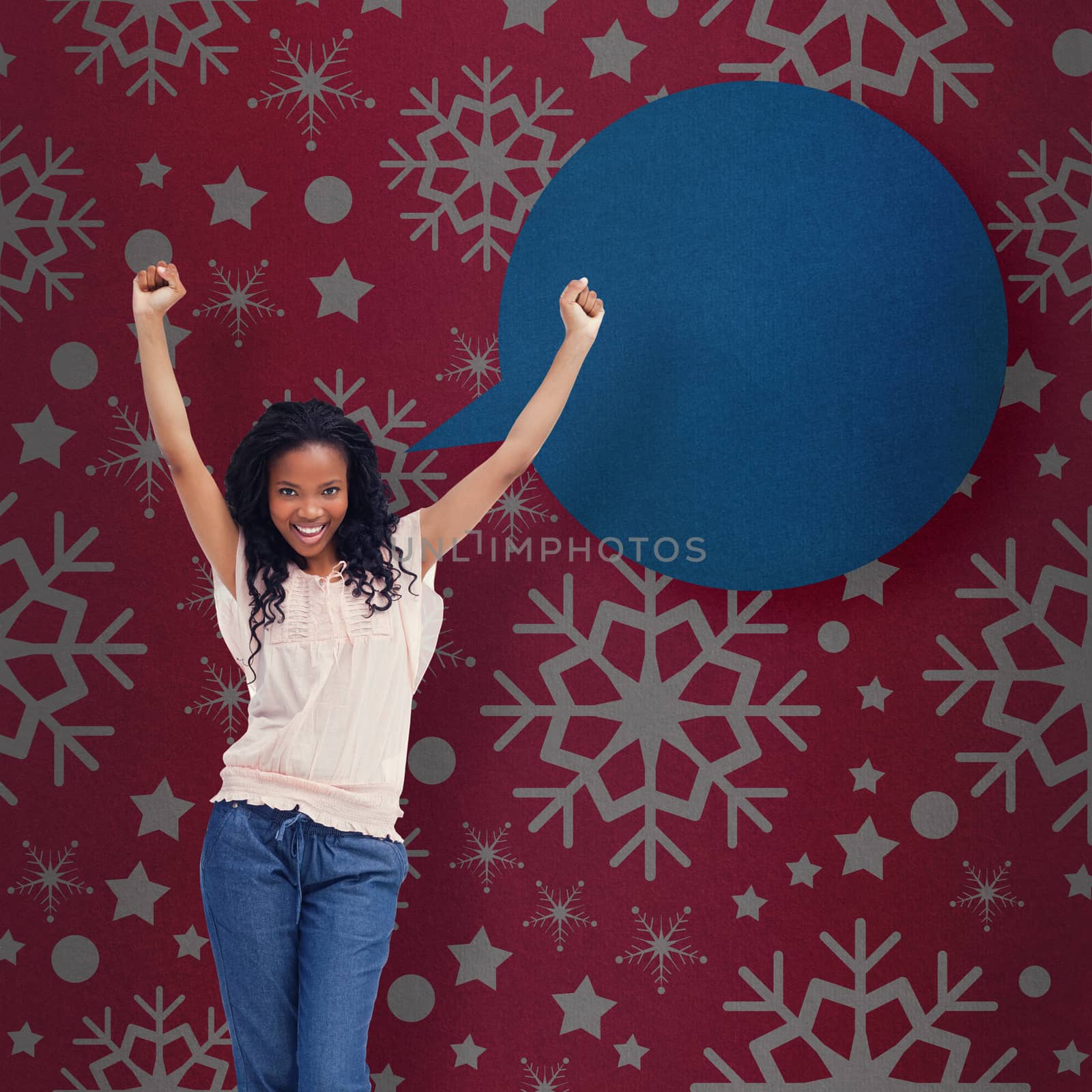 A young happy woman stands with her hands in the air against red vignette