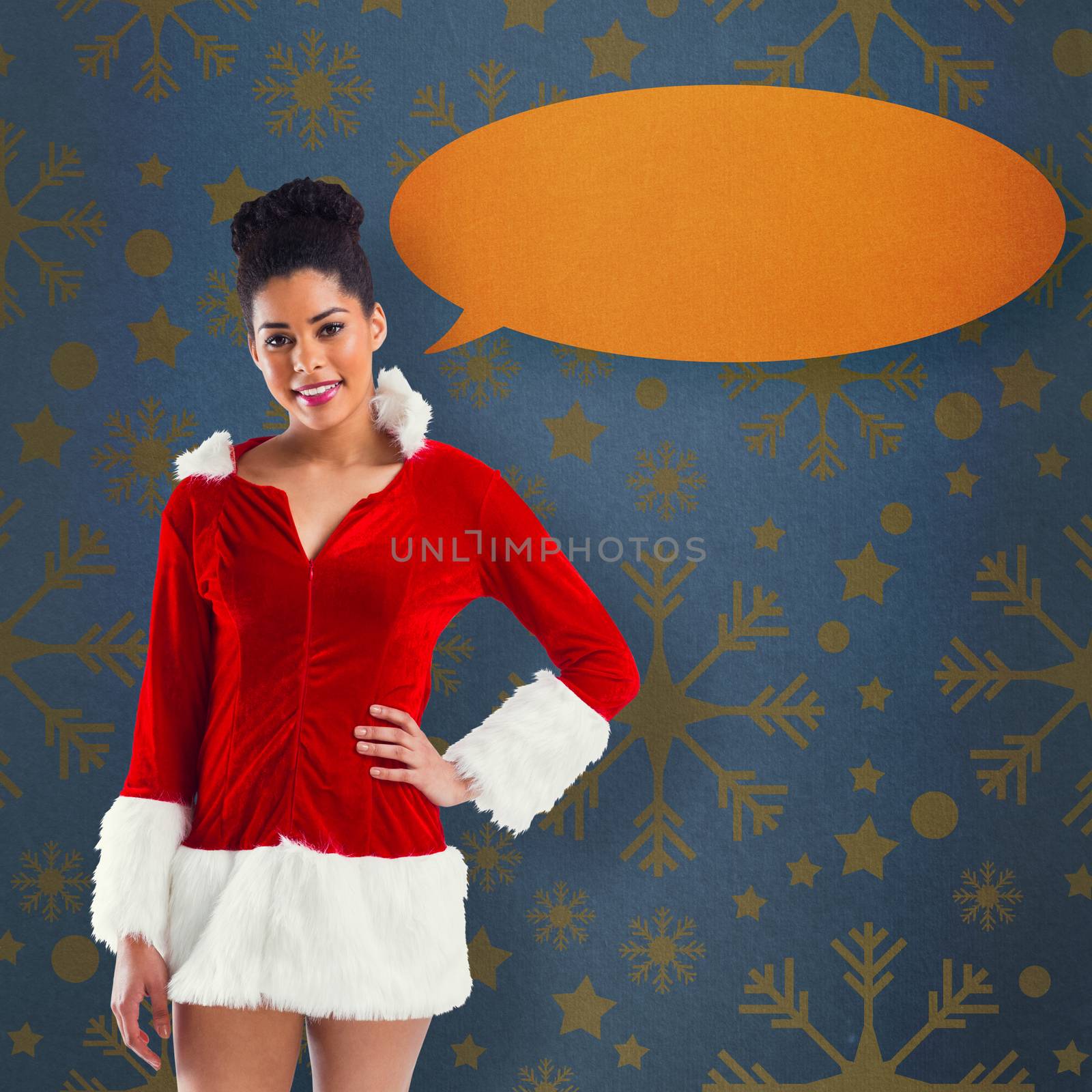 Pretty santa girl smiling at camera against blue vignette