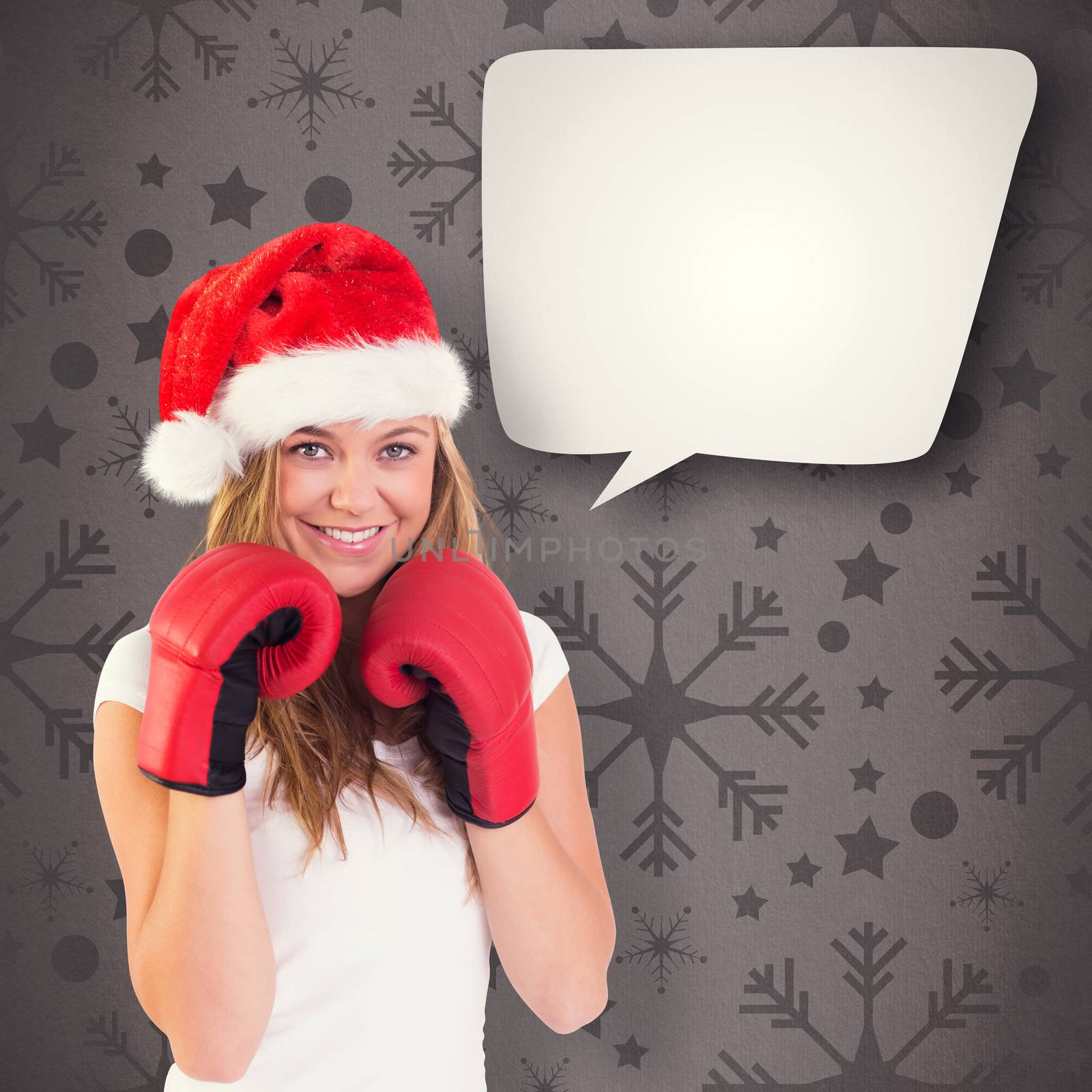 Composite image of festive blonde with boxing gloves by Wavebreakmedia