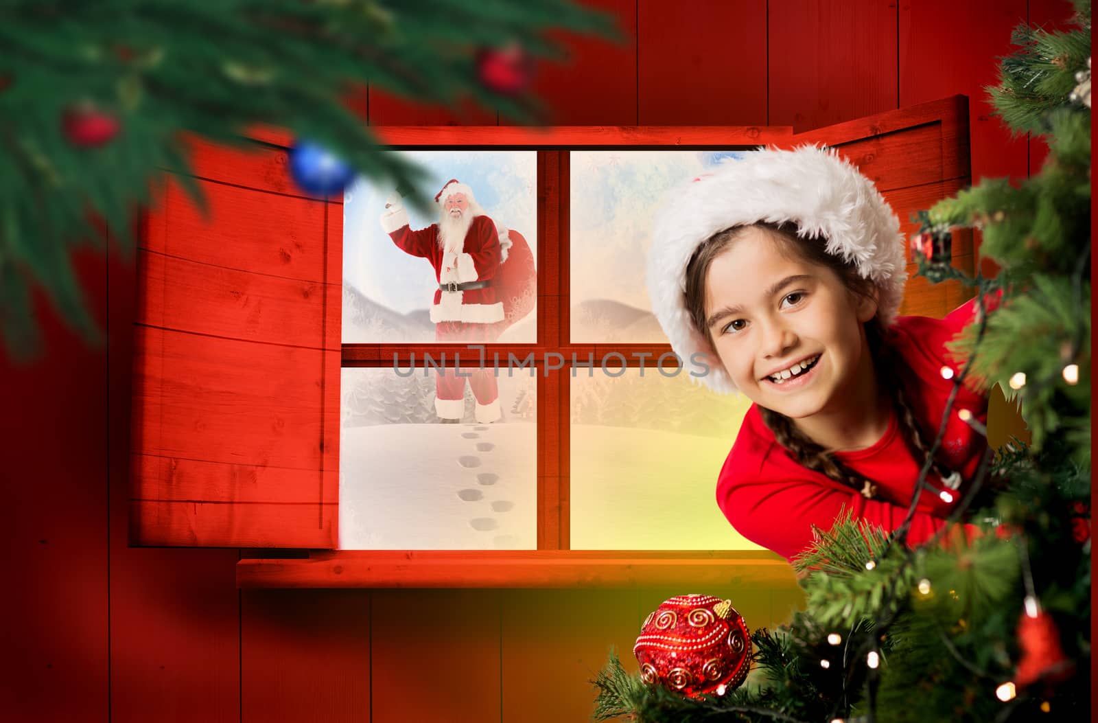 Composite image of festive girl looking from behind christmas tree by Wavebreakmedia