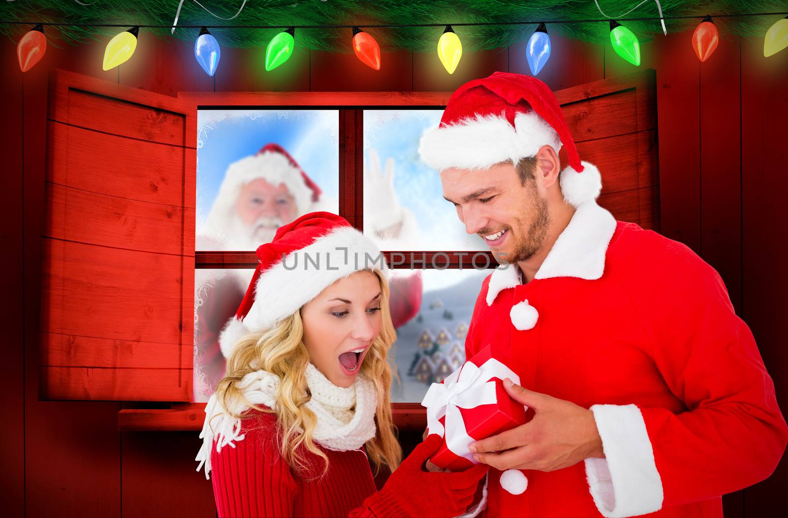 Composite image of young festive couple by Wavebreakmedia