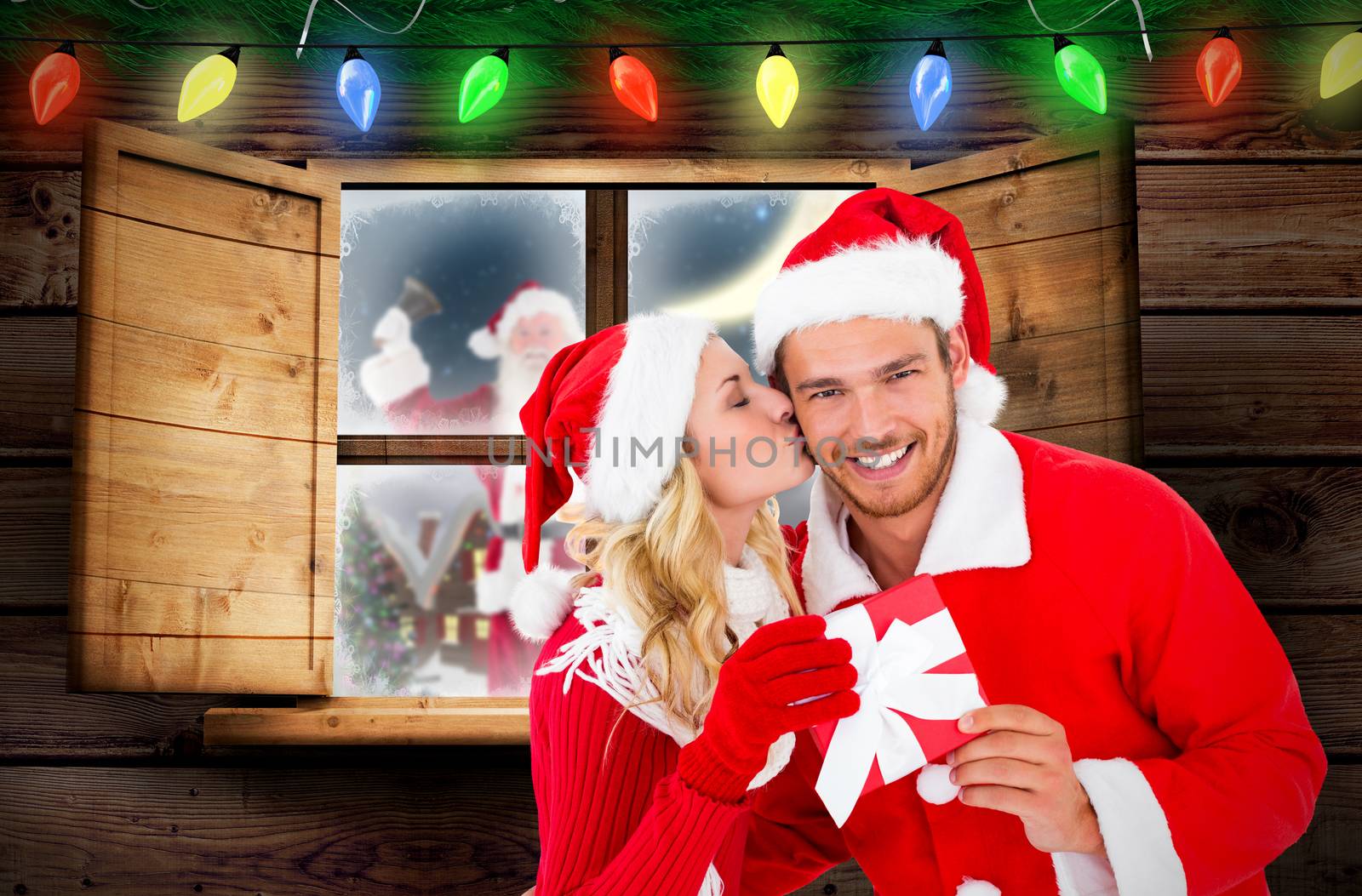 Composite image of young festive couple by Wavebreakmedia