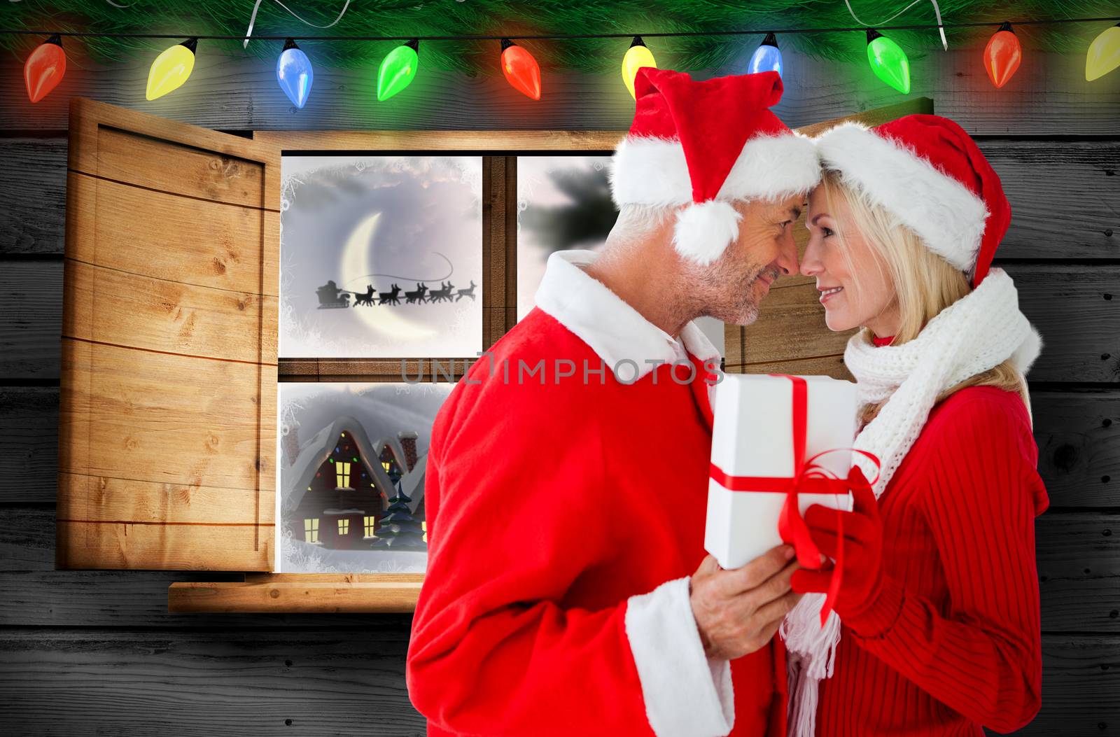 Composite image of festive couple by Wavebreakmedia