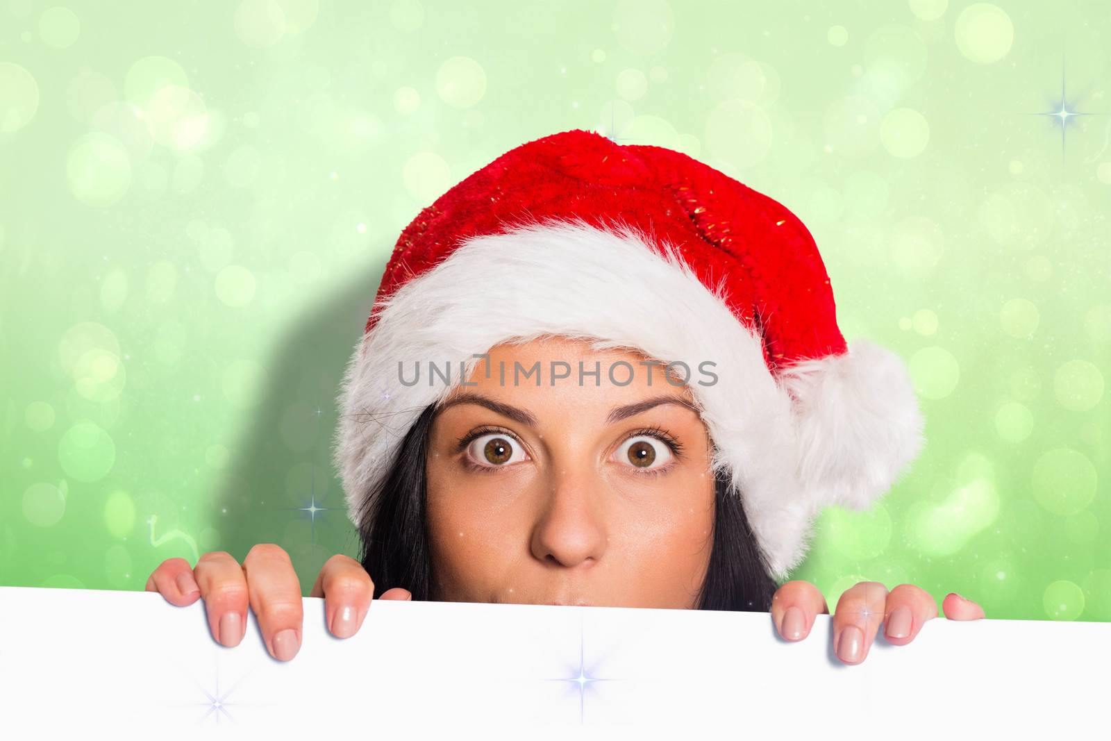 Woman surprised at the camera against green abstract light spot design
