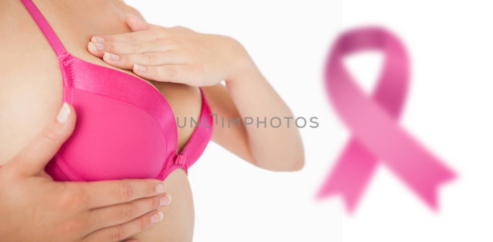 Composite image of closeup of woman performing self breast examination by Wavebreakmedia