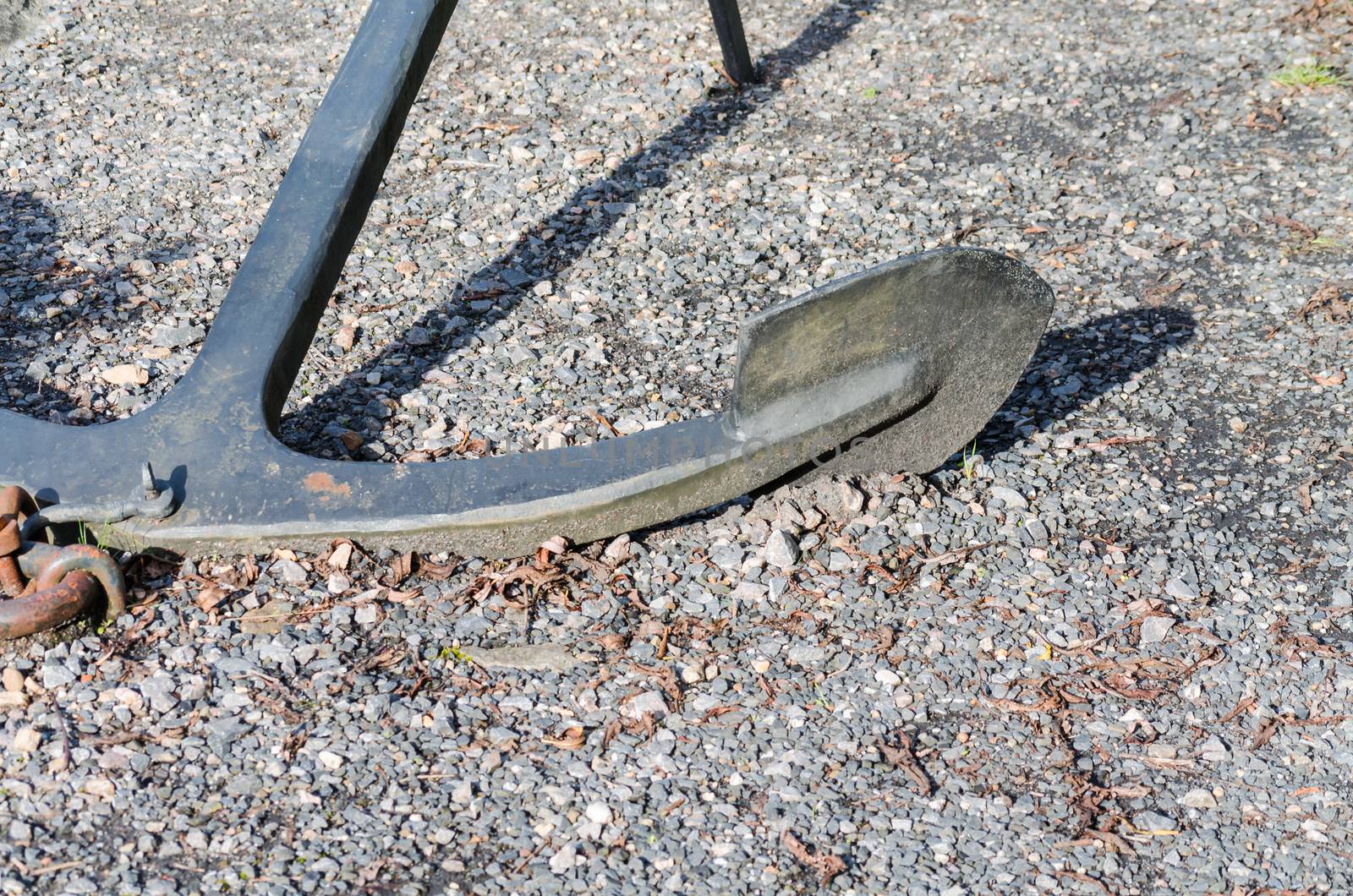 Age heavy black anchor with chain. 
