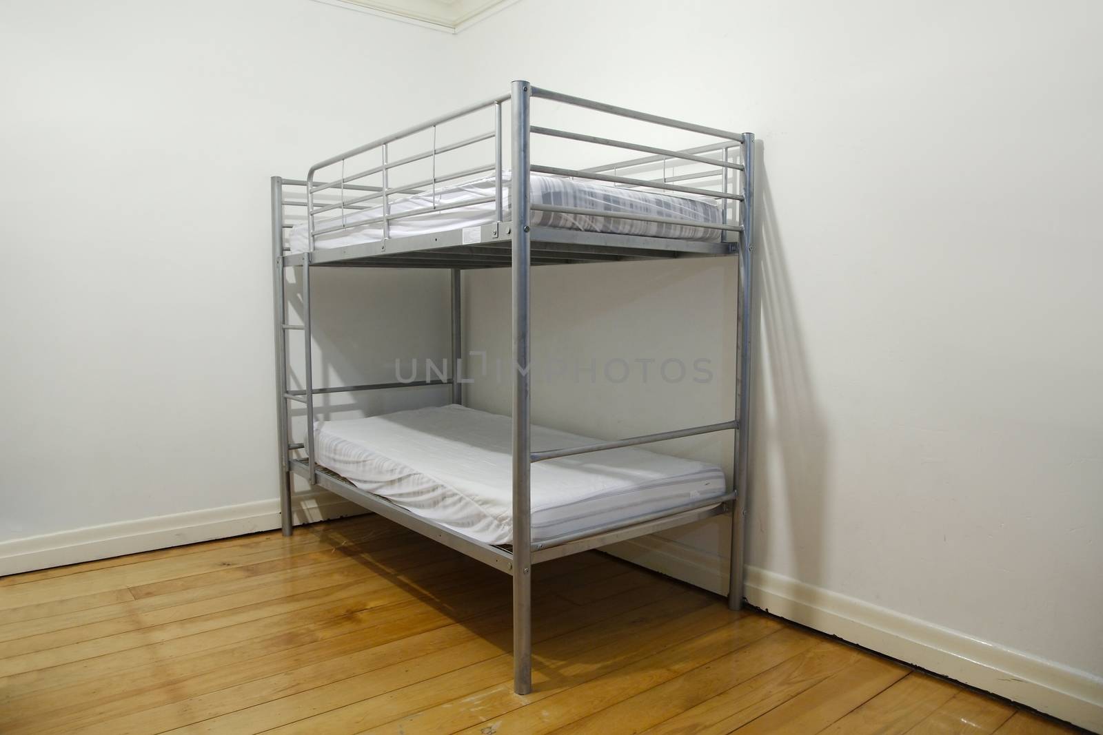 Simple bunk bed in the corner of a room