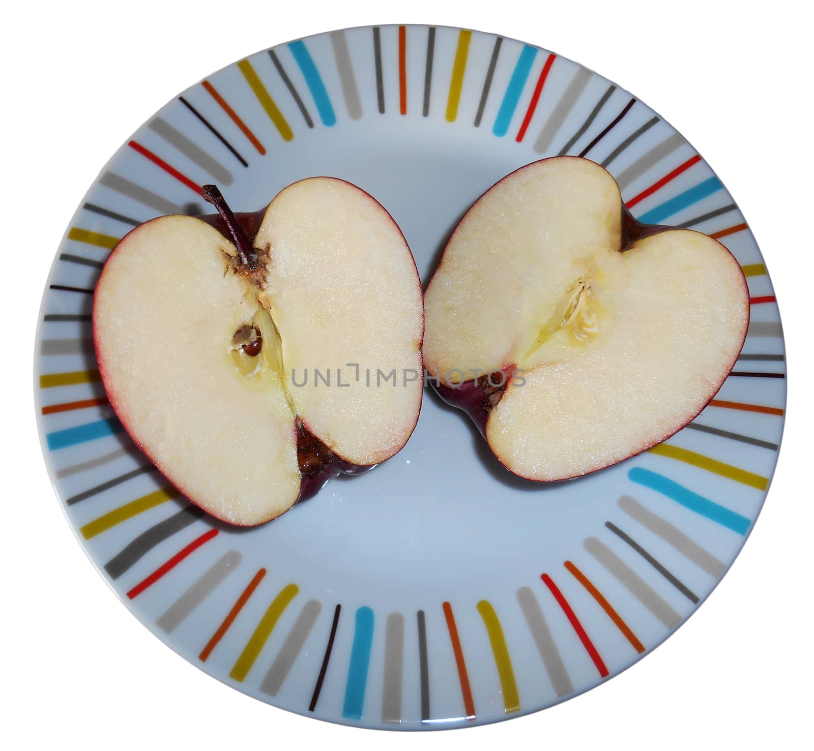 Two halves of an apple on a colourful plate, isolated on white.

Picture taken on November 21, 2014.