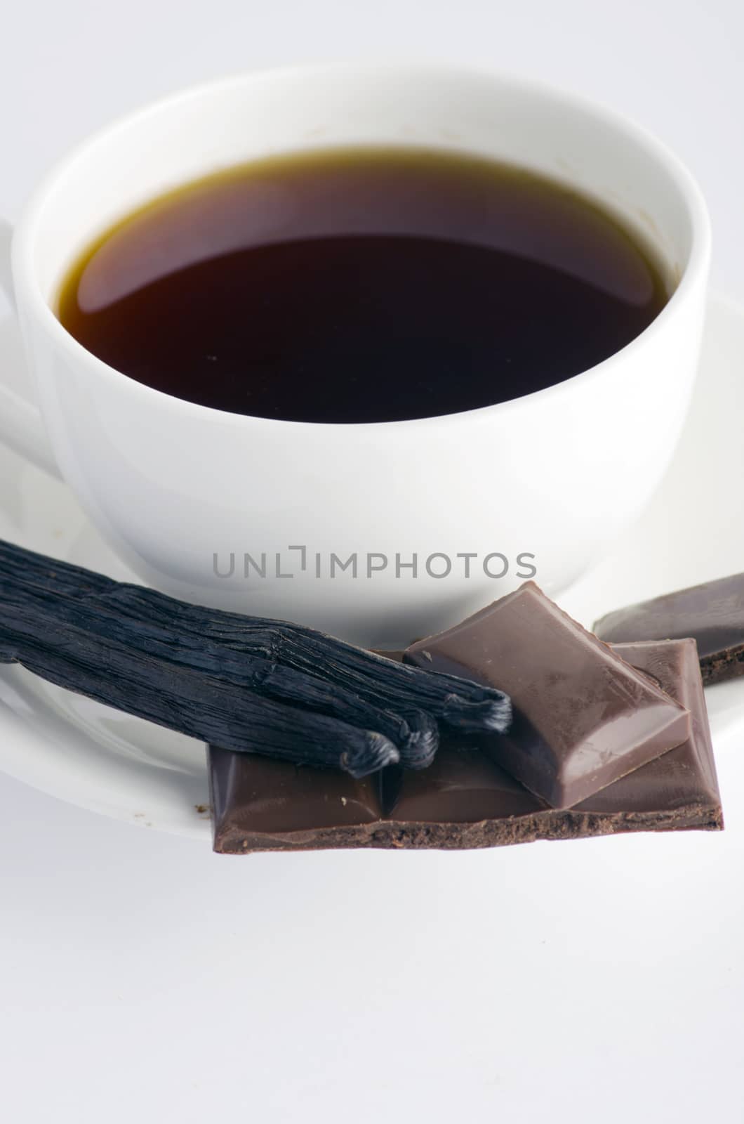 Cup of hot tea with dark chocolate by dolnikow