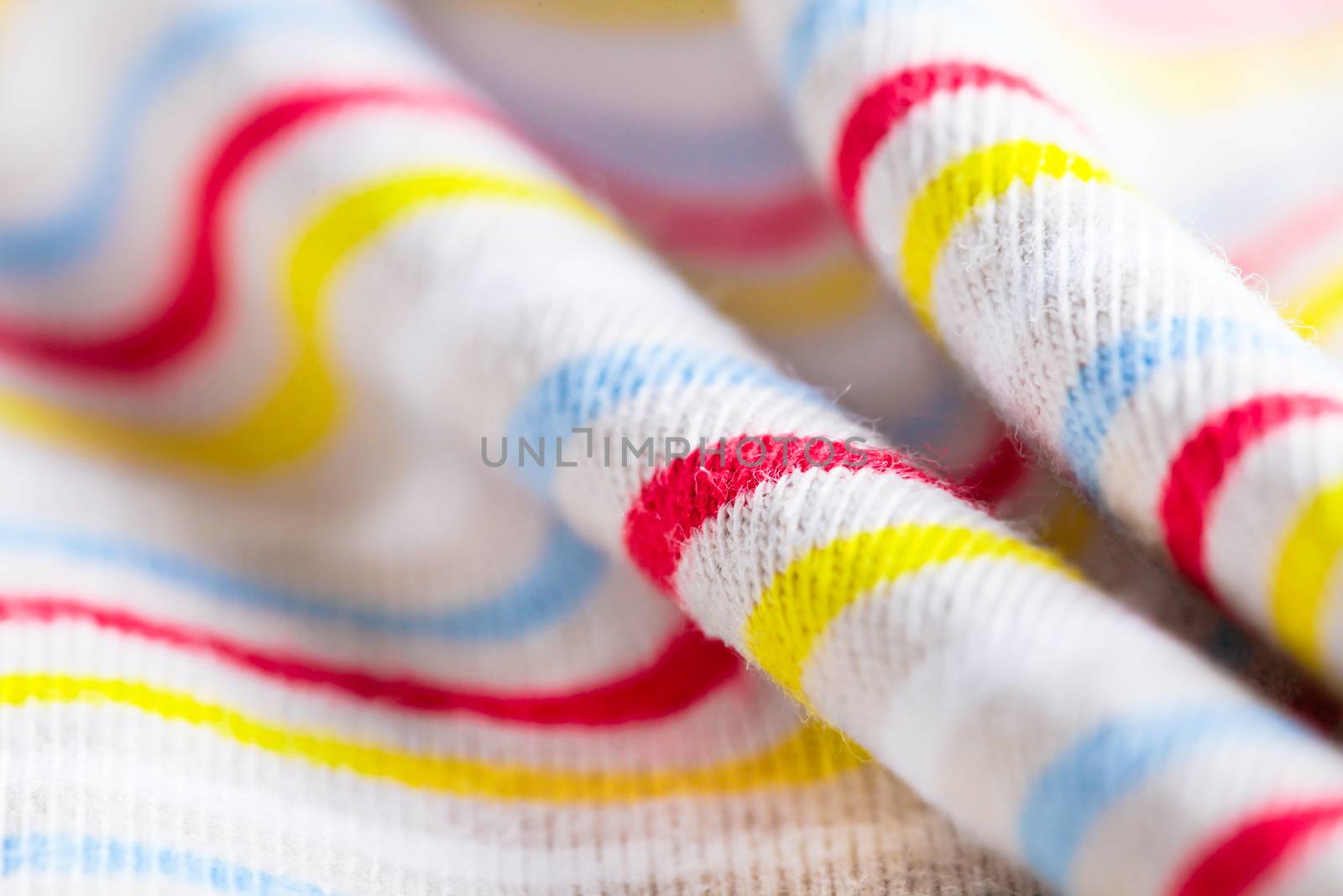 Colorful stripey material with a shallow depth of field