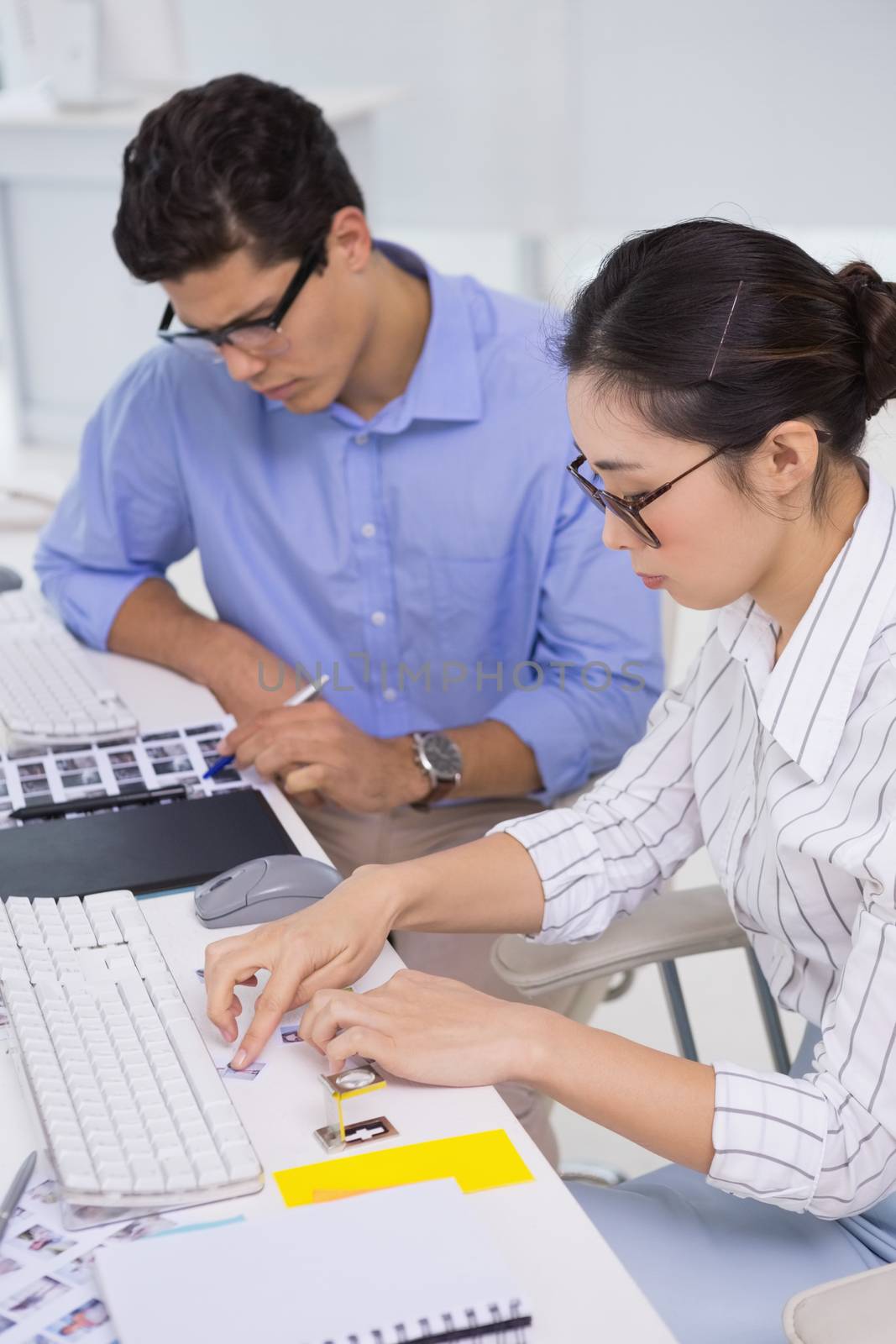 Creative team working at desk in creative office