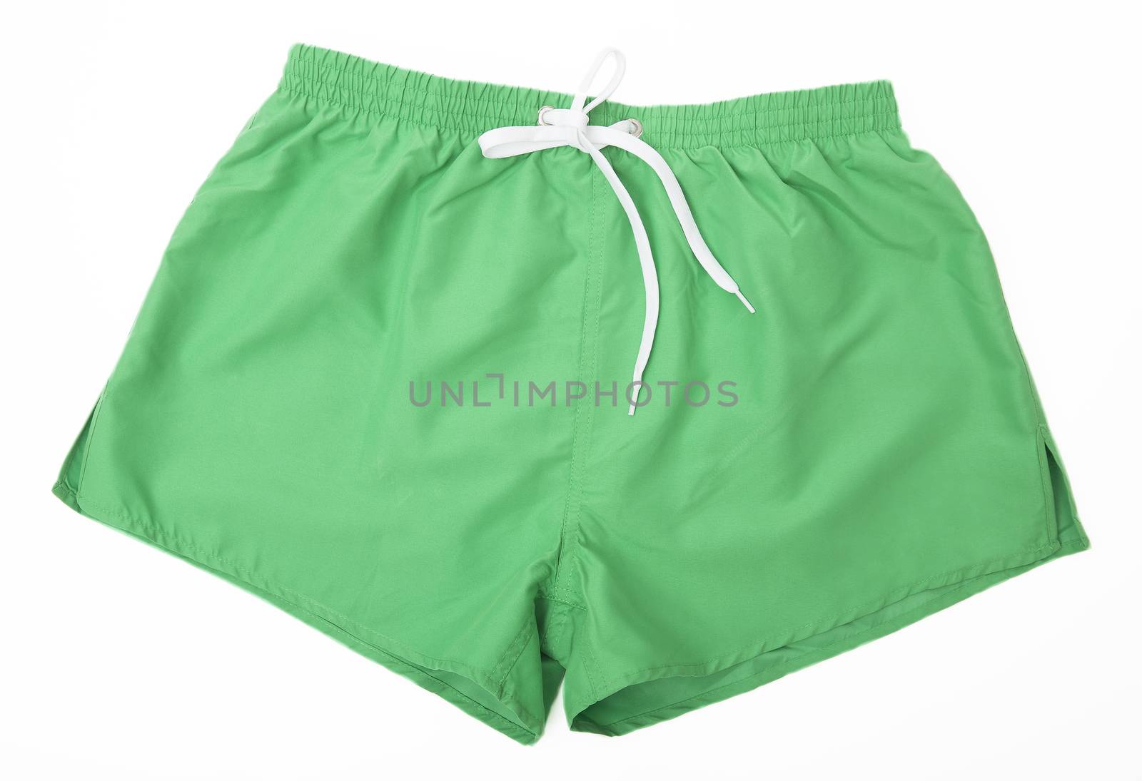 Green Sport shorts isolated on green background