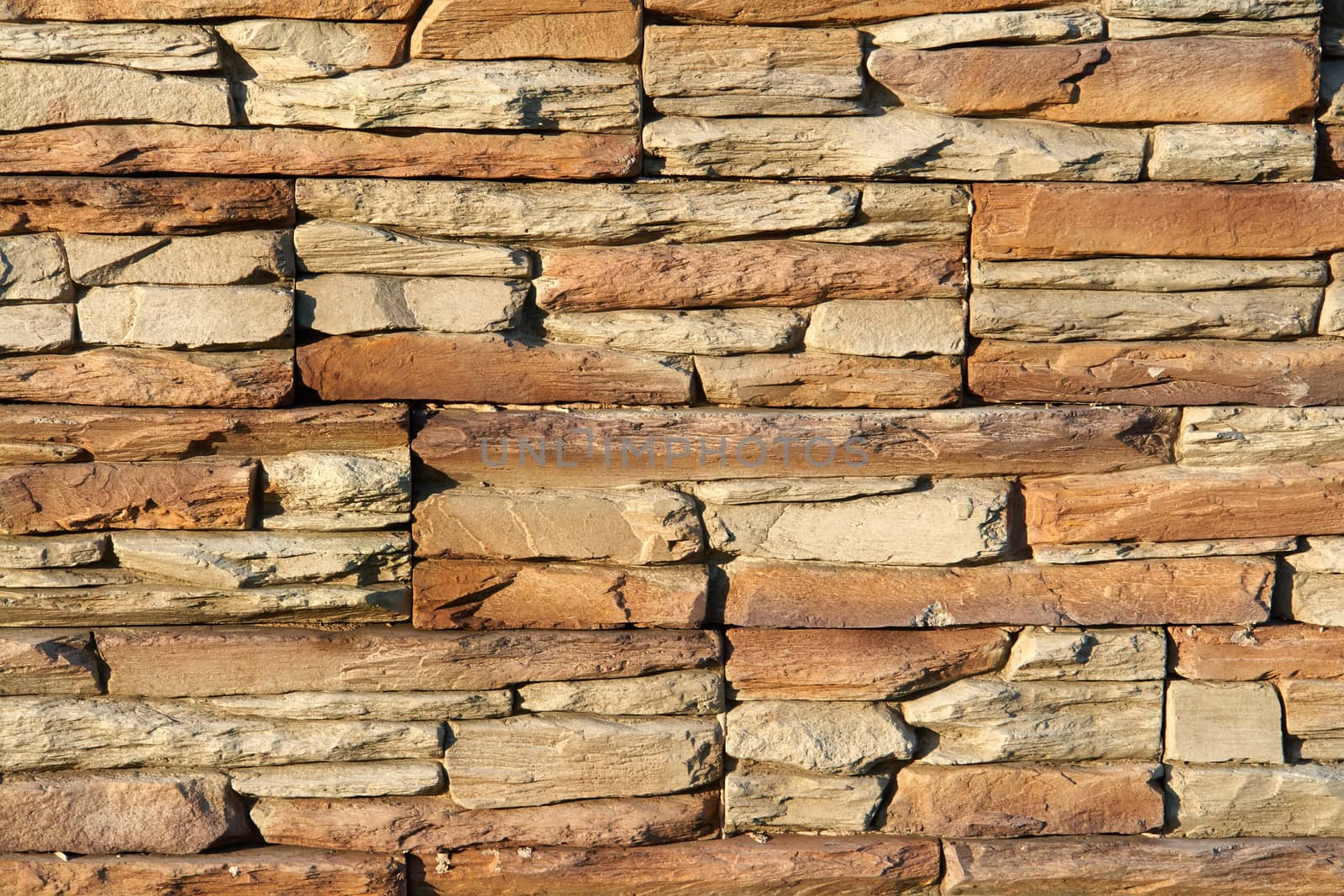 Brown shades color decorative design uneven stone stucco wall                               