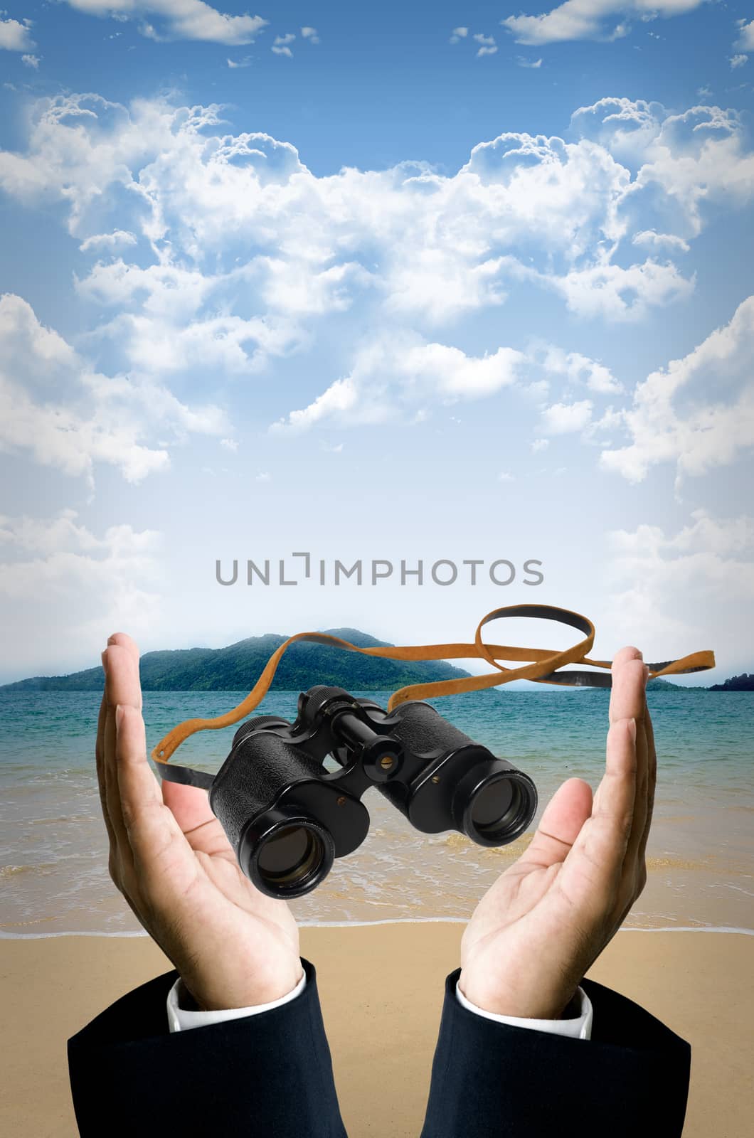  Binocular in hand at beach by pixbox77