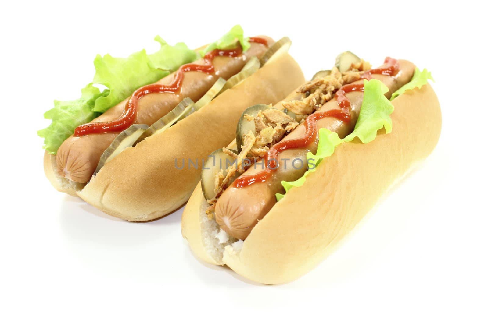 Hot dogs with ketchup and fried onions by discovery