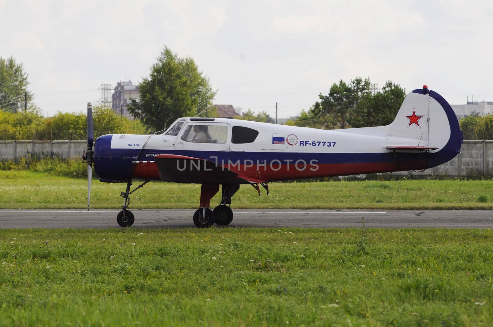 The Yak-18t plane on a runway. by veronka72