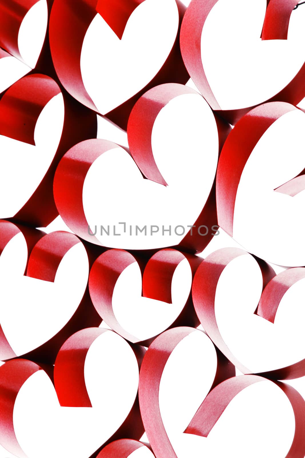 Linked red ribbon hearts isolated on white background