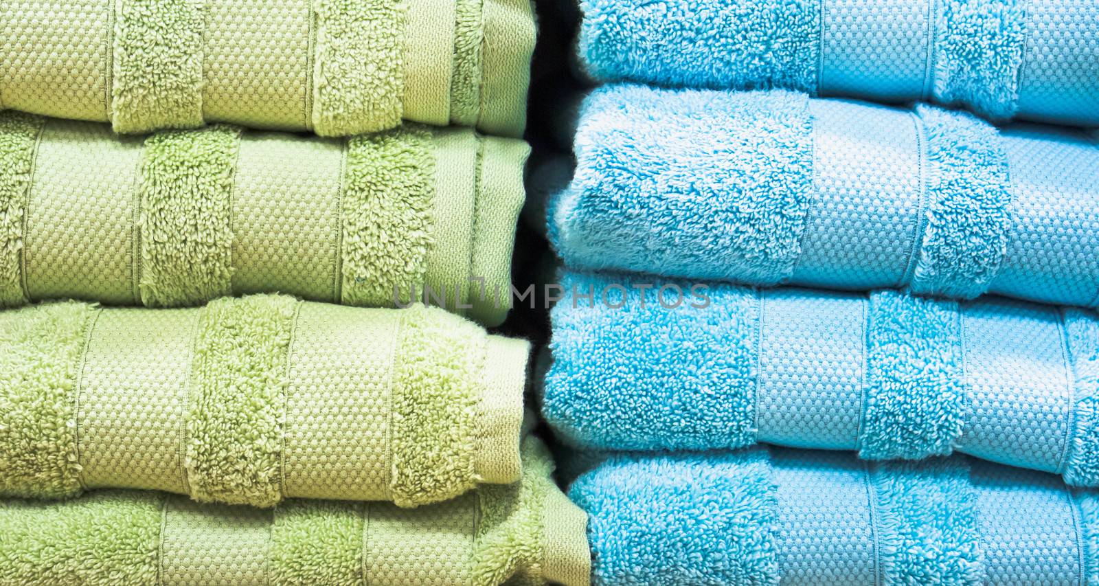 Stacks of blue and green towels