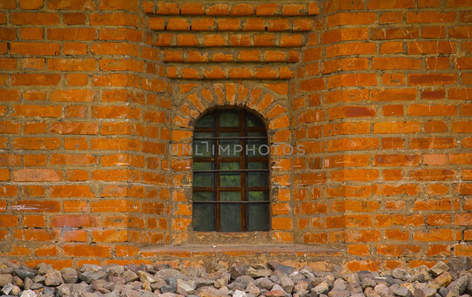 Old red brick wall with window closeup