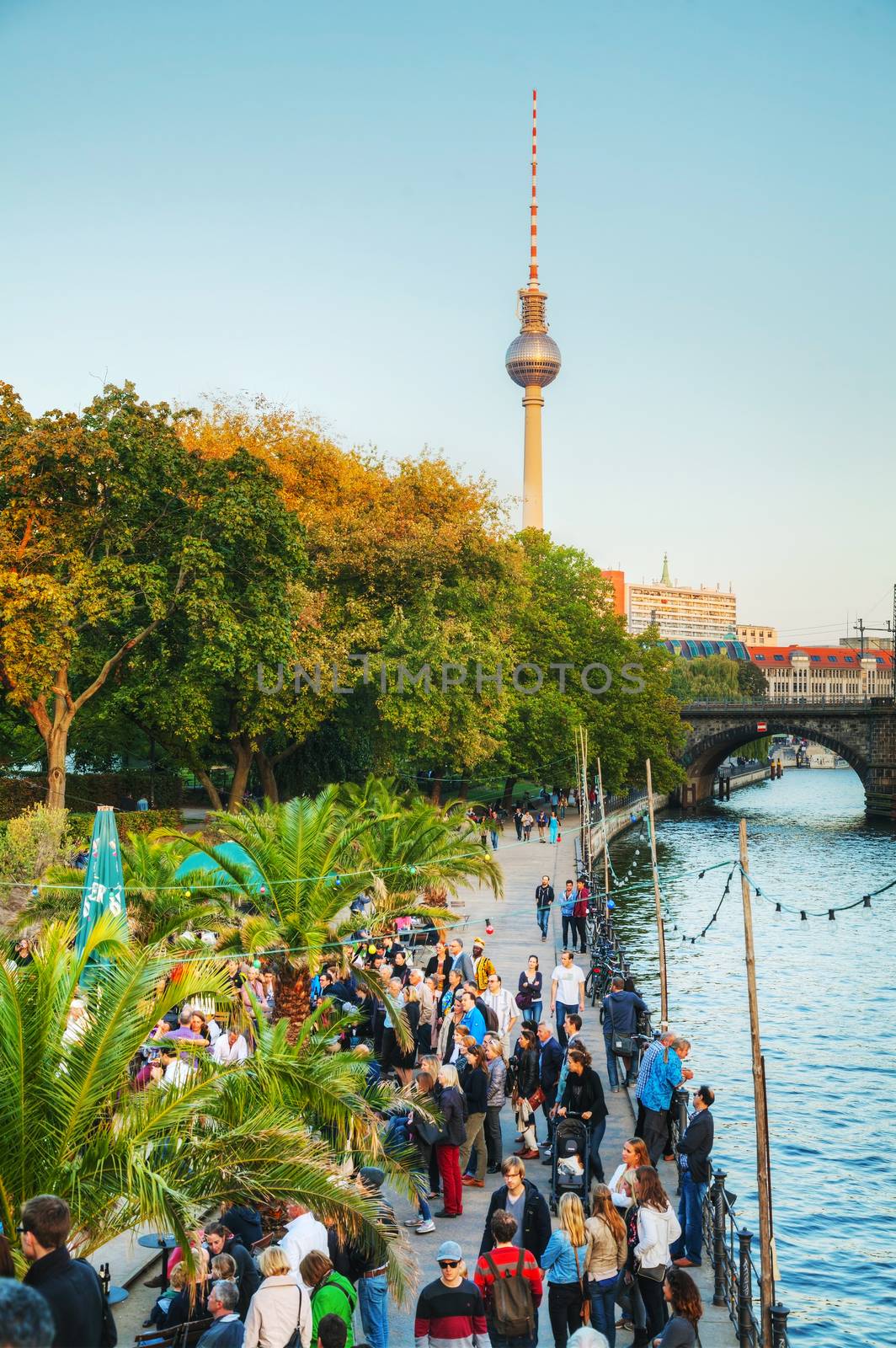 BERLIN - OCTOBER 3, 2014: Spree embankment at Mitte district in the evening on October 3, 2014 in Berlin, Germany. Mitte is the first and most central borough of Berlin.