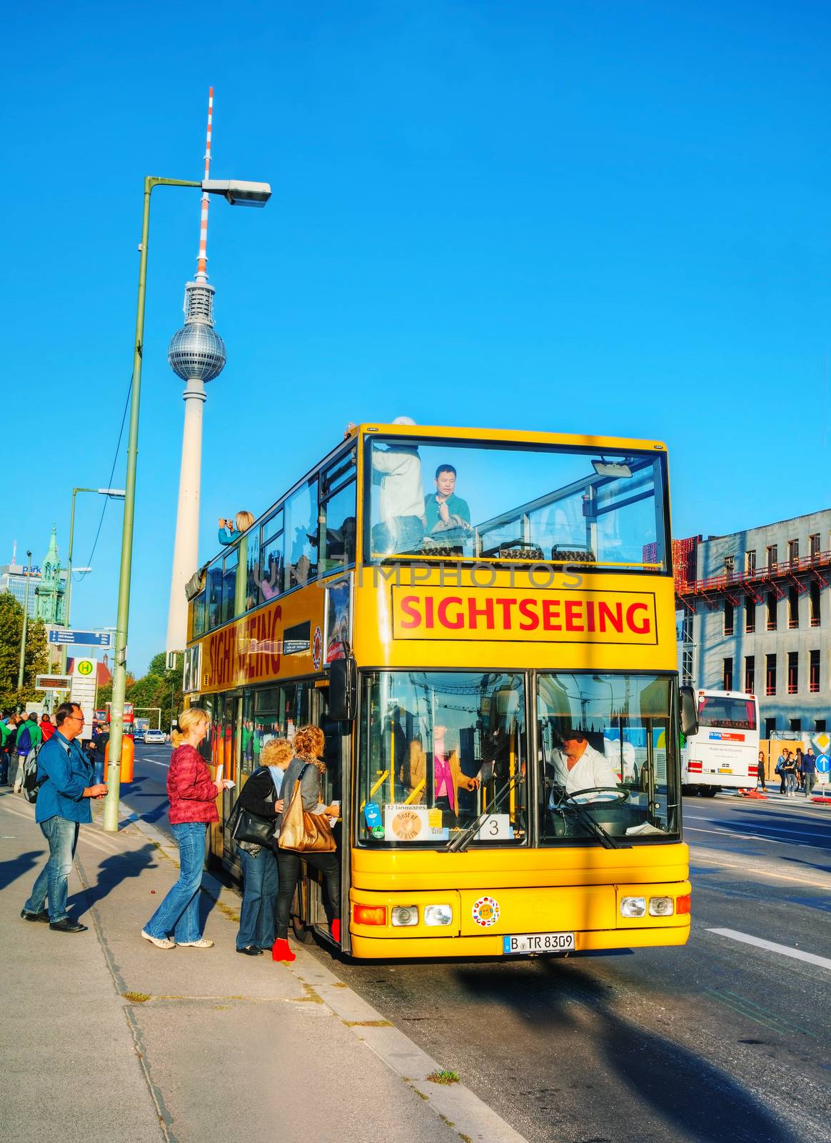 BERLIN - OCTOBER 3, 2014: Touristic bus at Berliner Dom on October 3, 2014 in Berlin, Germany. Berliner Dom is the short name for the Evangelical Supreme Parish and Collegiate Church. It is located on Museum Island in the Mitte borough.