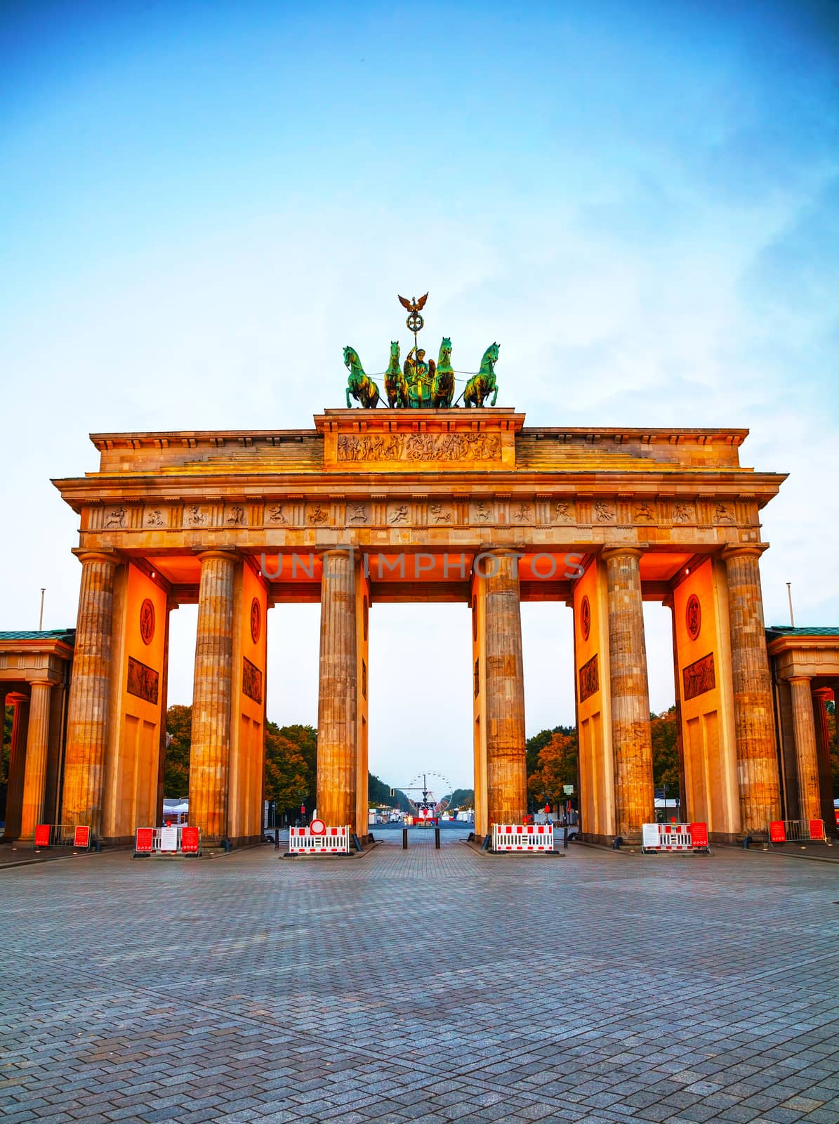 Brandenburg gate (Brandenburger Tor) in Berlin, Germany at sunrise